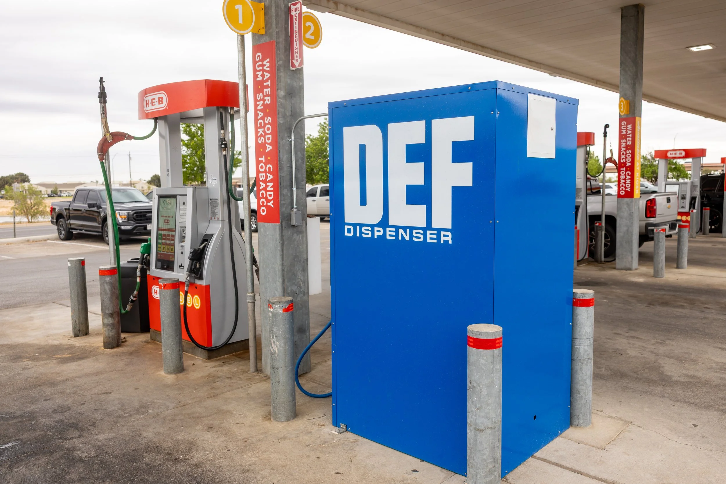 An Above ground DEF dispenser installed next to a gas pump