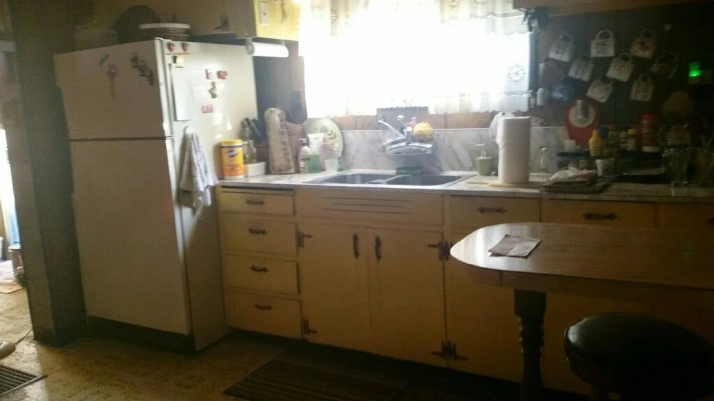 Total remodel of a separated kitchen and eating space into an open-concept kitchen with custom cabinets in a period-specific design.