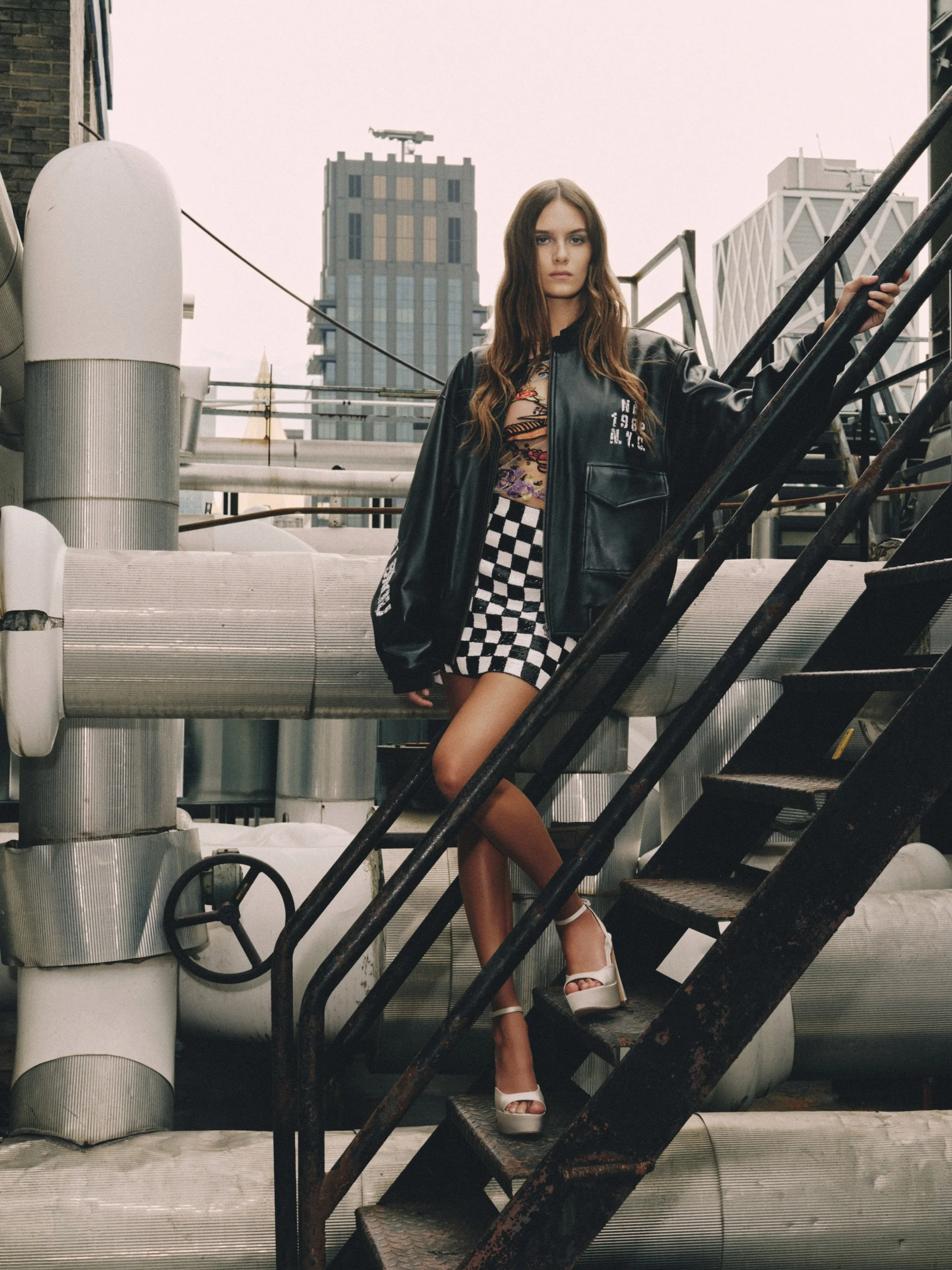 NM STATE OF MIND
&nbsp;
A study in contrasts for Spring/Summer 2027.
&nbsp;
Graphic checks meet bold prints and oversized leather, capturing Nicole Miller&rsquo;s signature mix of pattern and texture.
&nbsp;
A distinctly Nicole Miller take on downtow