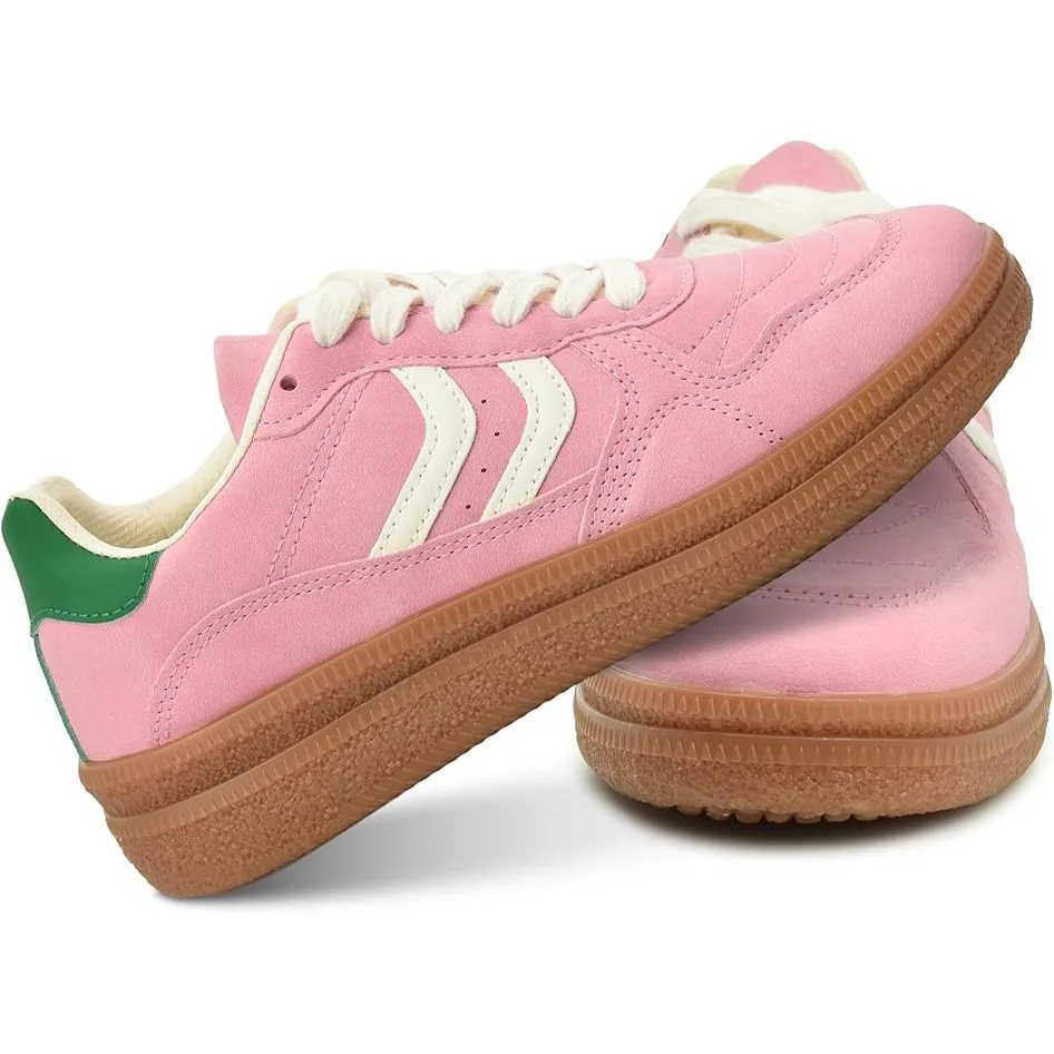 Pink sneakers with white laces, cream and green accents, and gum rubber soles