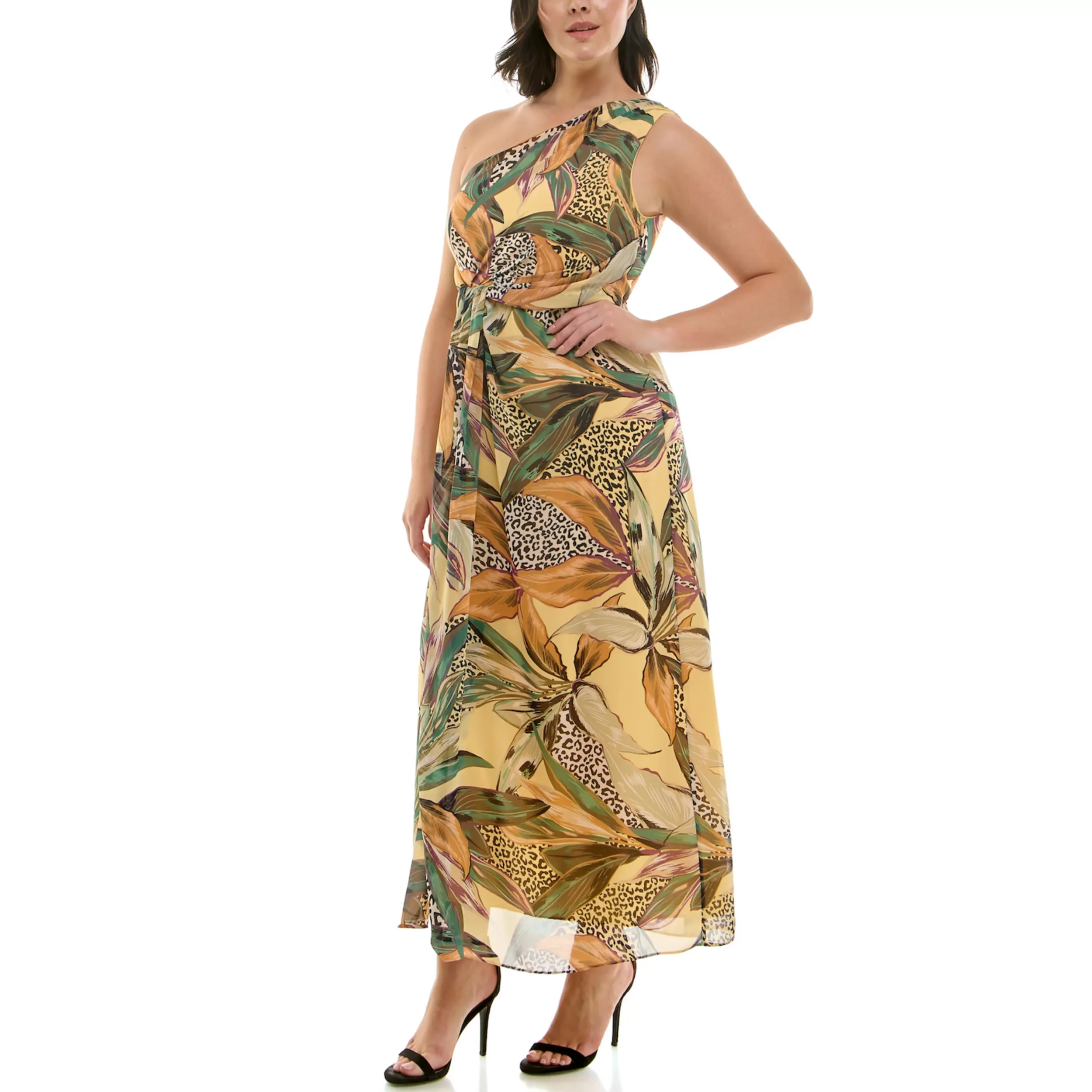 A woman wearing a colorful, tropical-patterned maxi dress with one shoulder strap, paired with black high heels.