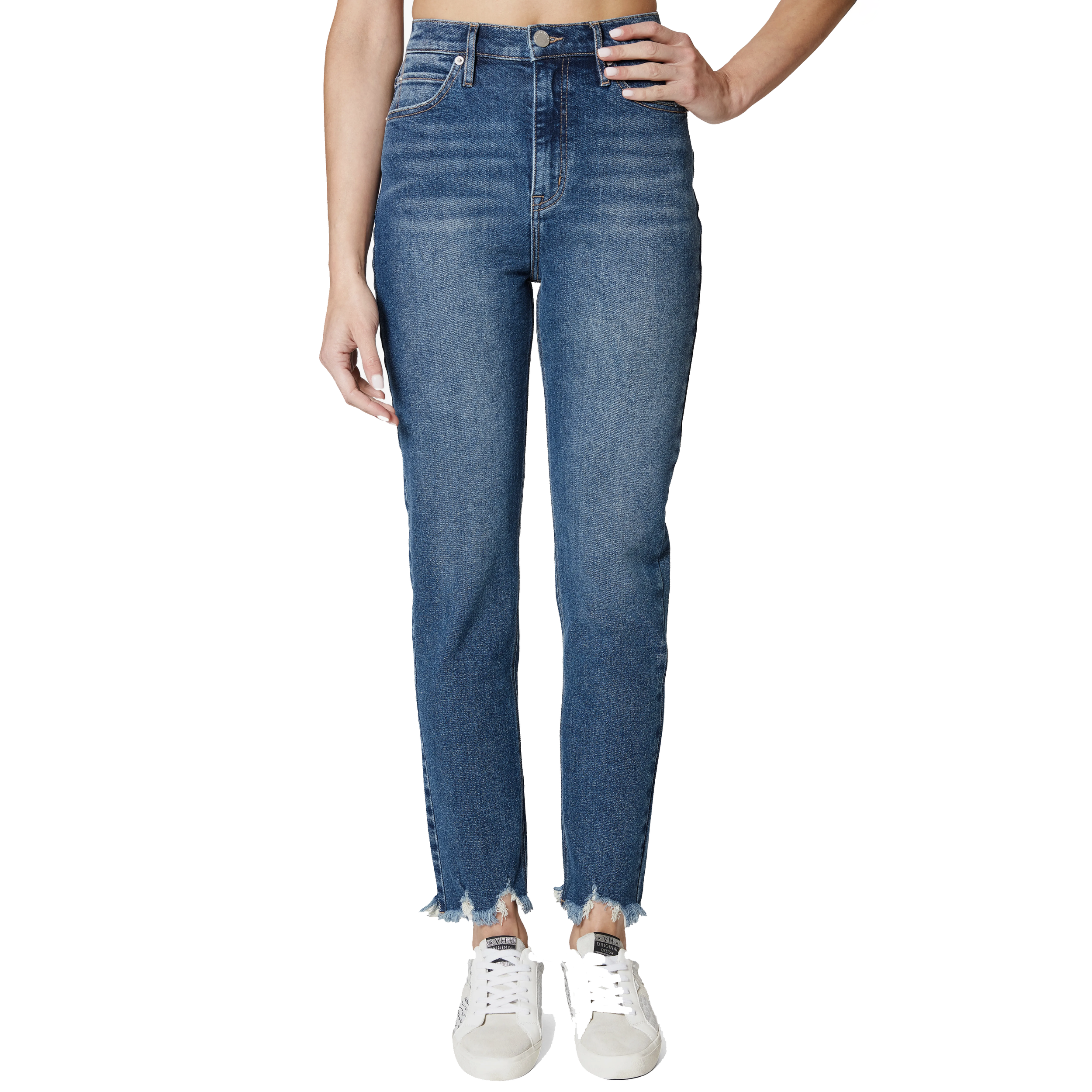 Pair of high-waisted, blue distressed jeans with frayed hems, worn with white sneakers.