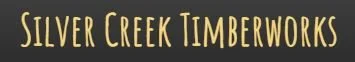 Silver Creek Timberworks sign with black background and yellow text