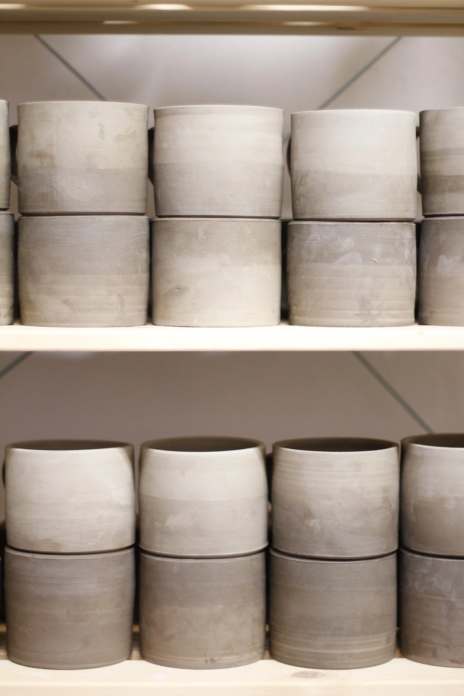 Mugs drying before bisque firing