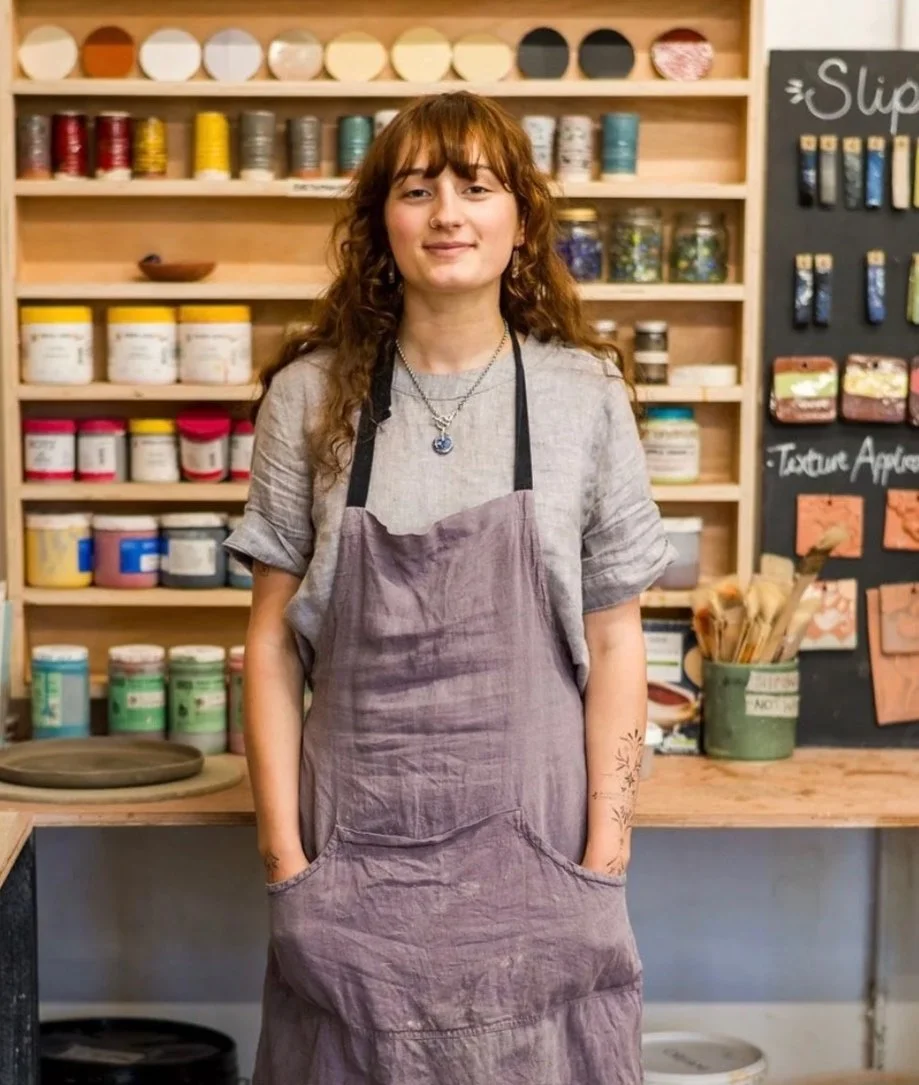 A photo of Anna https://potterybyanna.com working as a technician at Stroud Pottery