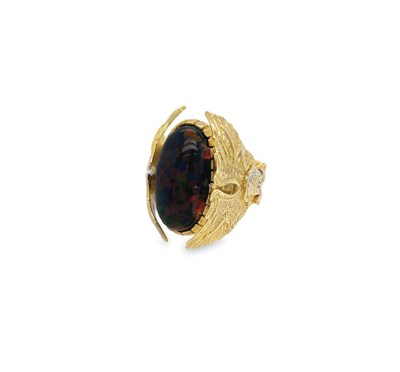 Gold ring with a large, oval black gemstone and intricate wing design.