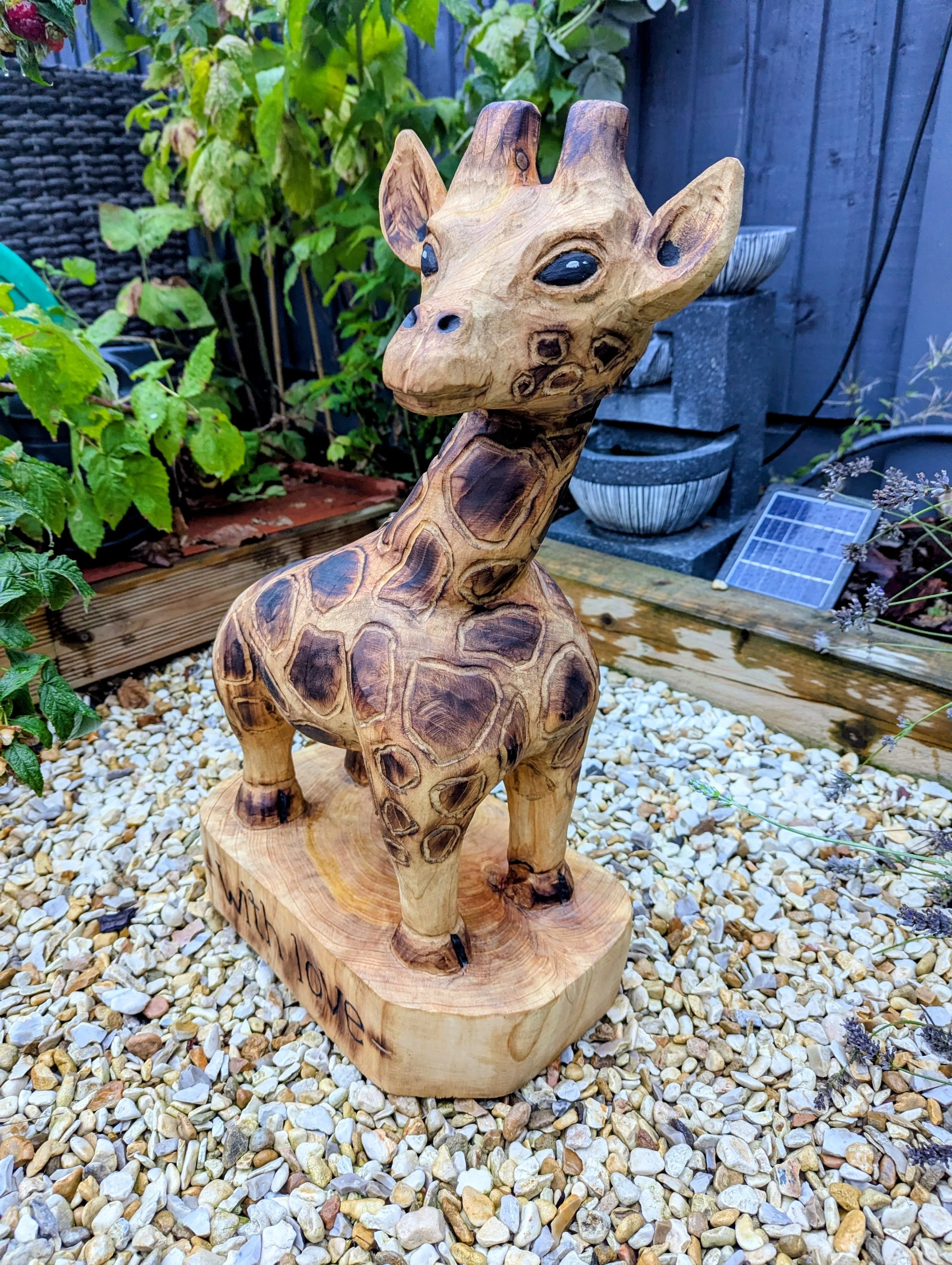 Giraffe chainsaw carving