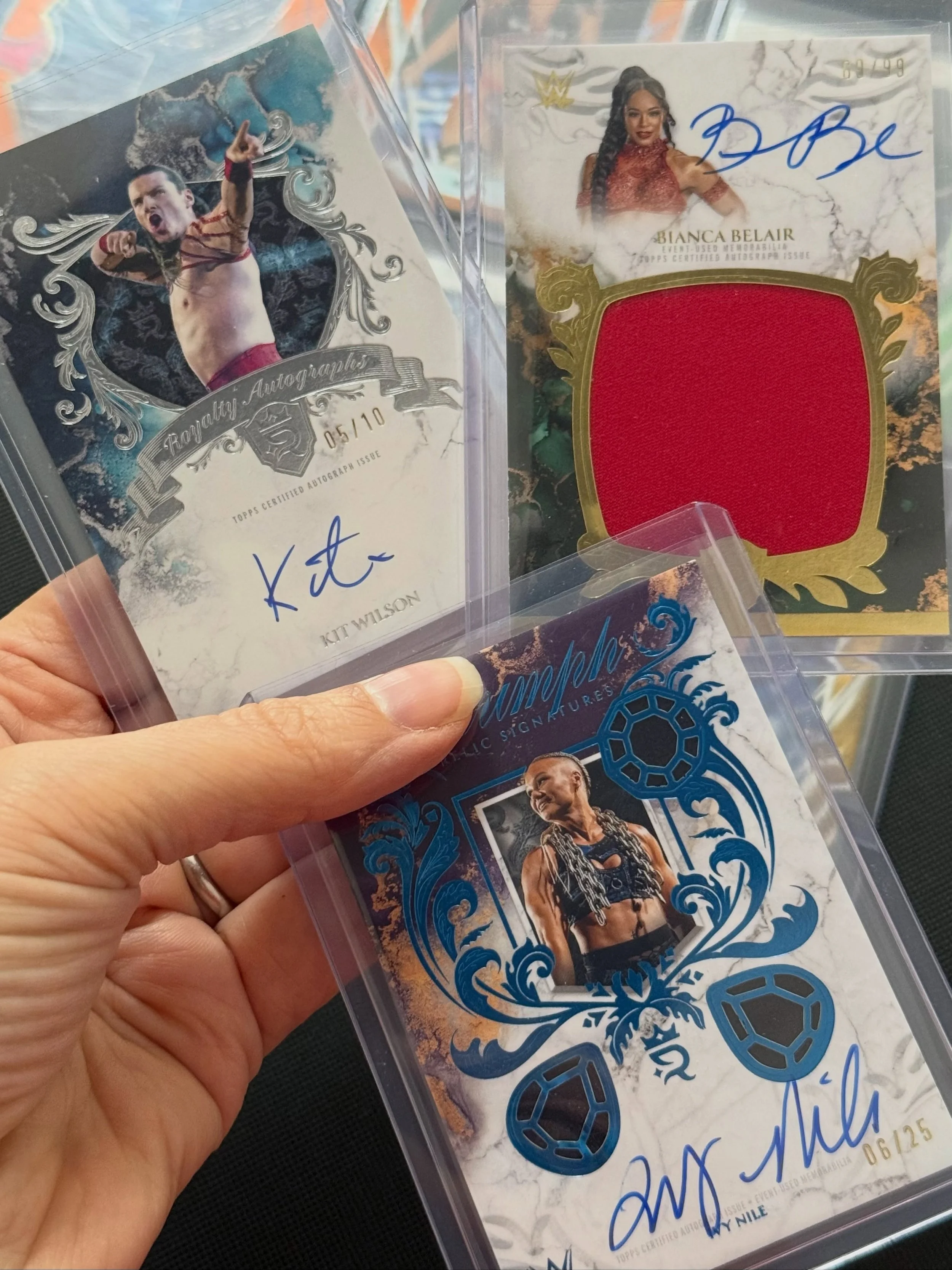 Latest additions to the PC from WWE Topps Royalty. 

Delighted with the significant upgrade to our Bianca Belair auto and FINALLY we have an Ivy Nile - she was the first numbered card we ever pulled from our first box, so has a special place. 

And t