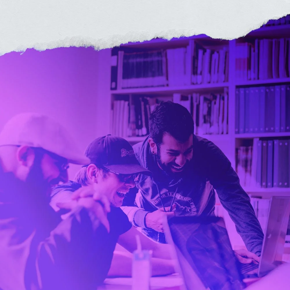 3 Designers collaborating and laughing