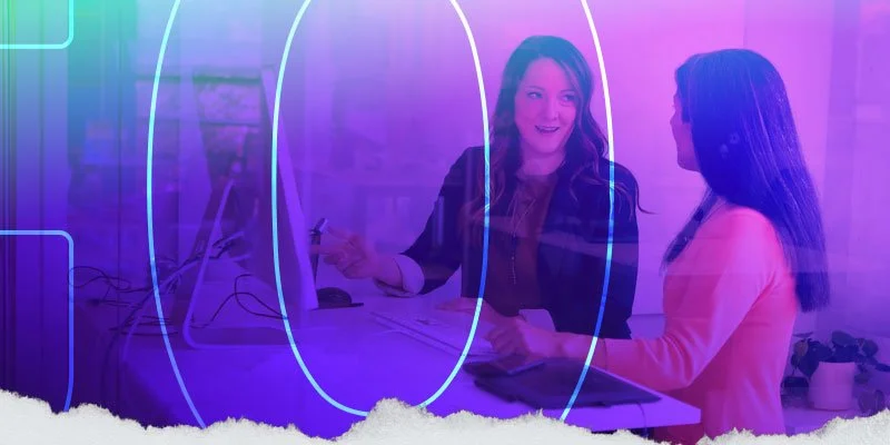 2 designers collaborating at a workstation