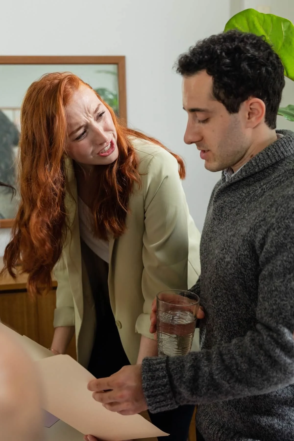 A woman leans toward her partner with a frustrated expression during a heated disagreement, the kind of communication breakdown a couples counselor in St. Louis, MO helps partners work through as a  St Louis Couples therapist.