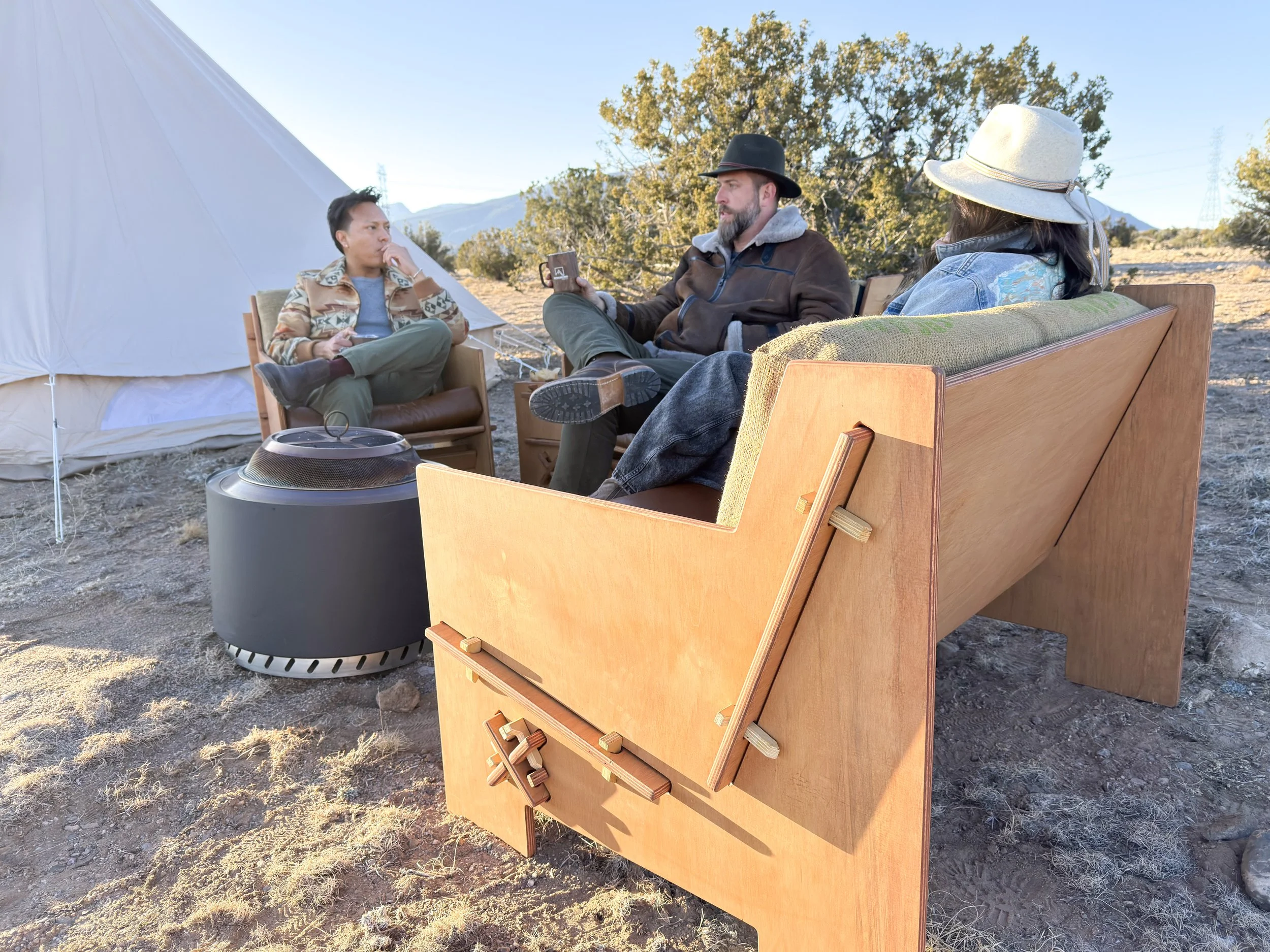 Group of friends enjoying a conversation outdoors on Mustang Home Goods furniture.