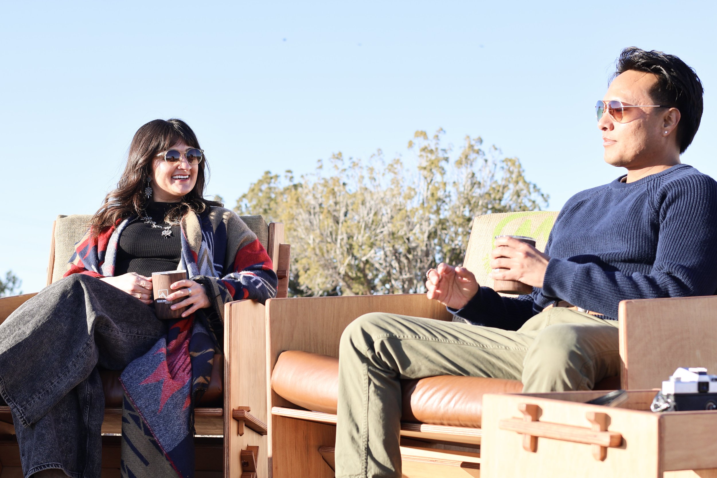Two people chatting casually outdoors.