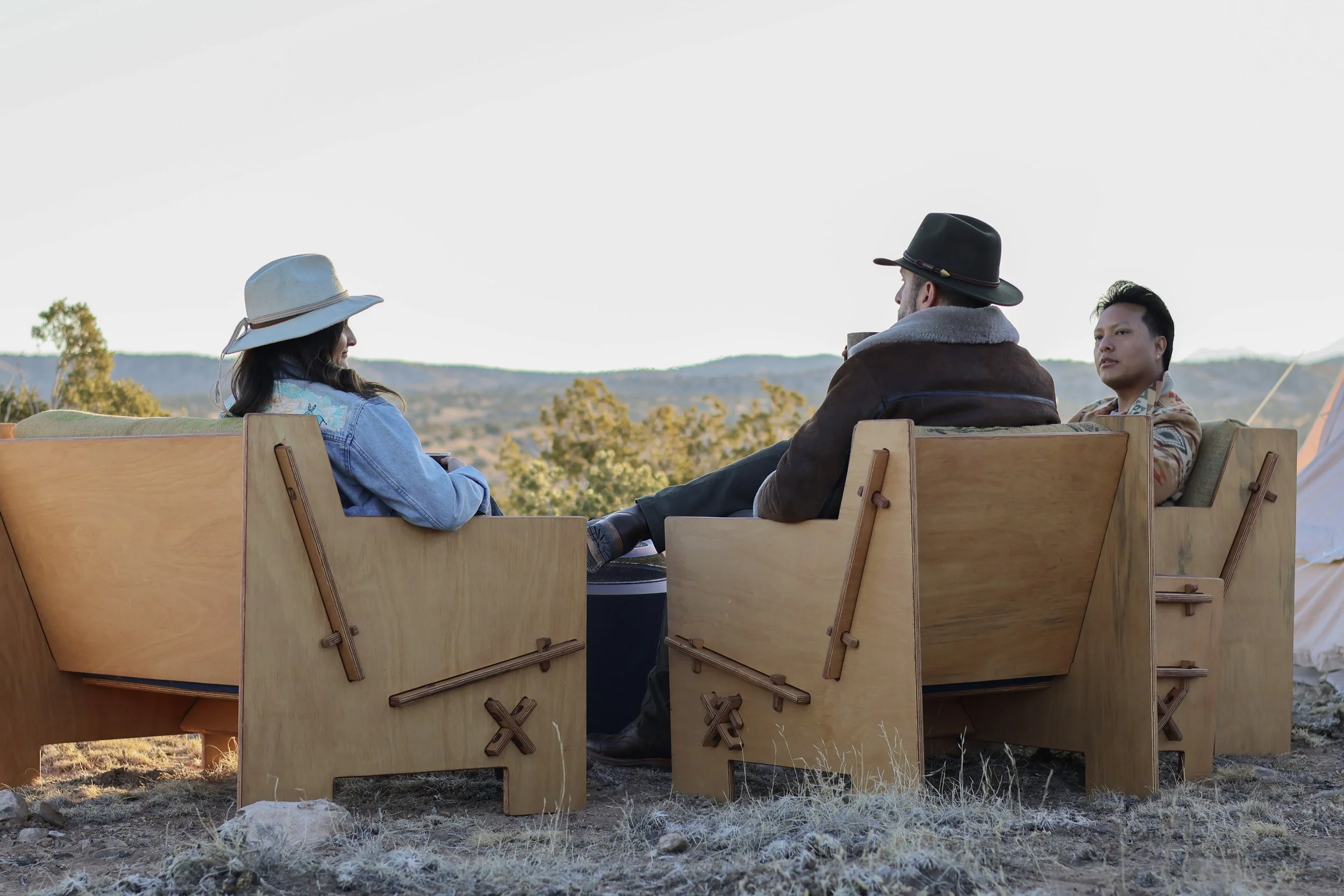 Group of friends enjoying the outdoors with Mustang Home Goods furniture.