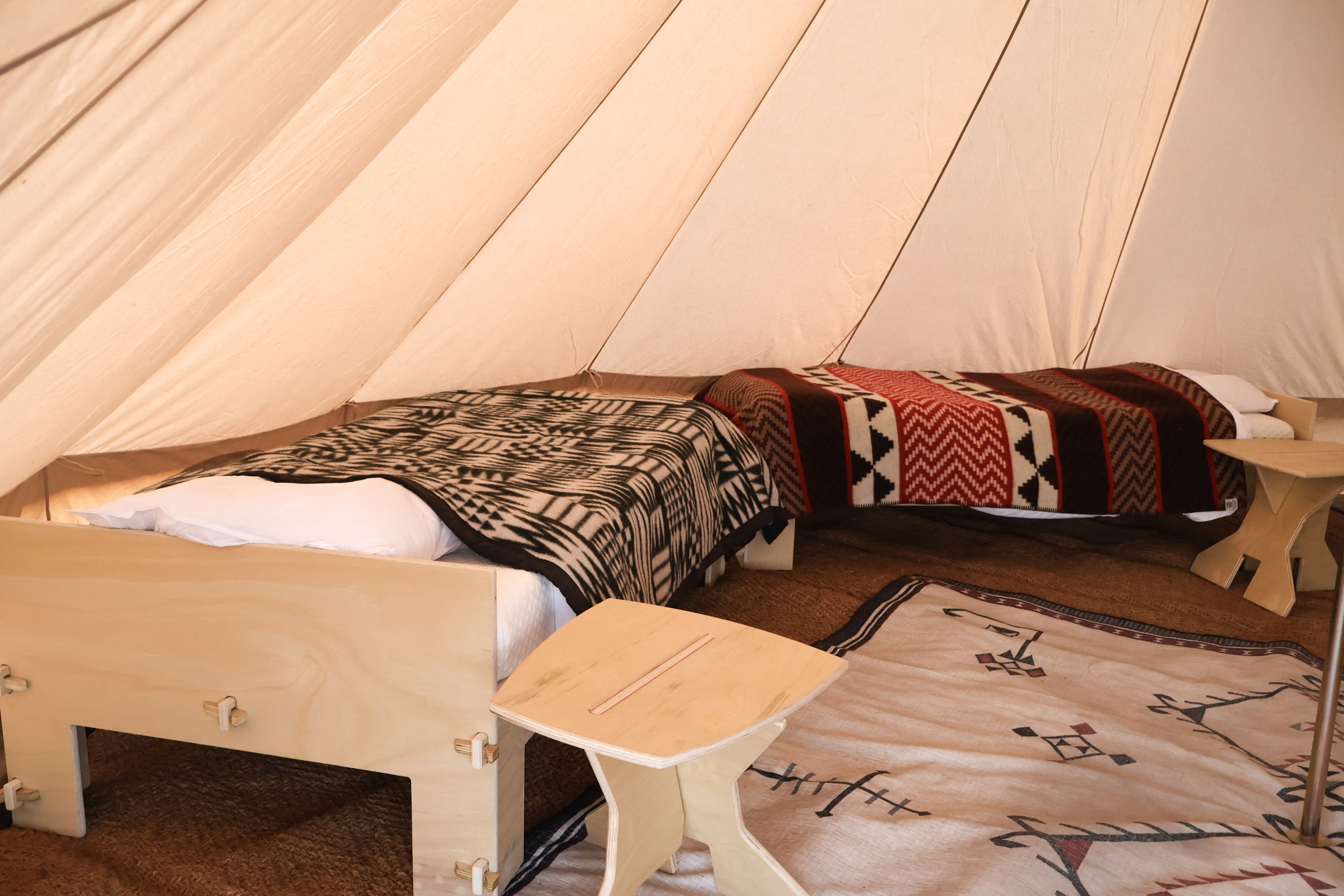 Mustang Home Goods bed styled for a glamping tent