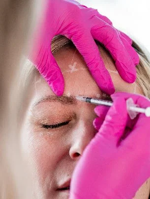 Trusted Nurse Injector Treating a Client with Tox