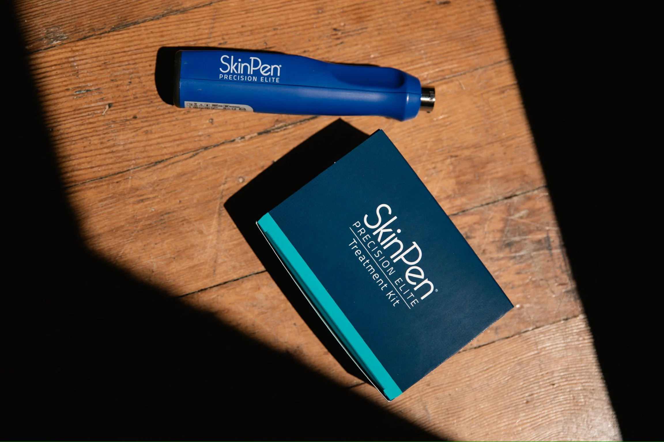 Ashley Martello, AM Injection Studio holding a microneedling pen