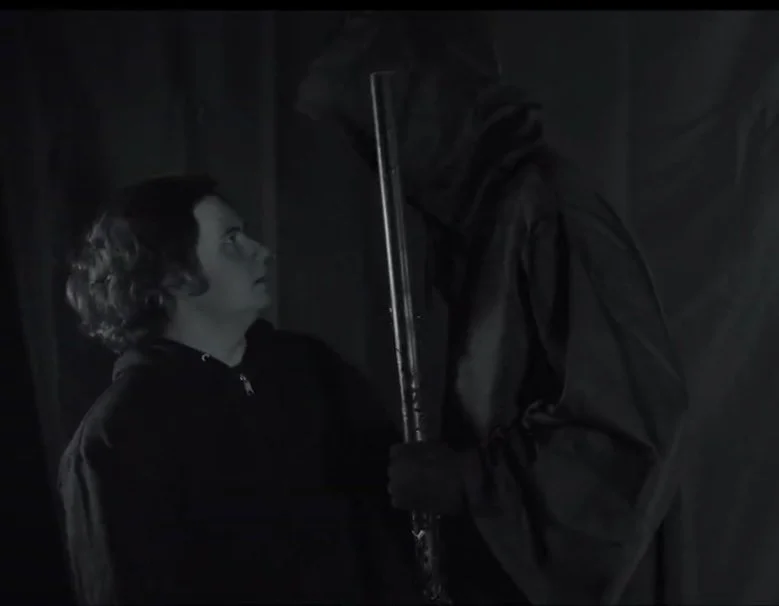 CJ as the daunting role of the Grim Reaper in "Down / Nowhere".