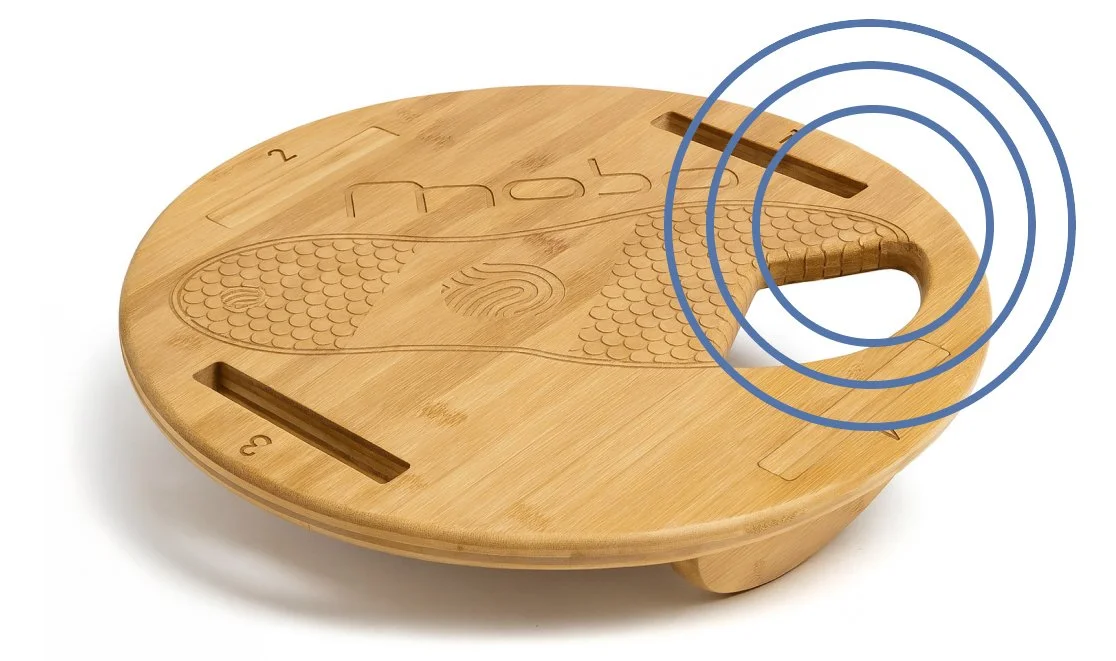 Round wooden sensory and fidget toy with textured patterns and sliding components