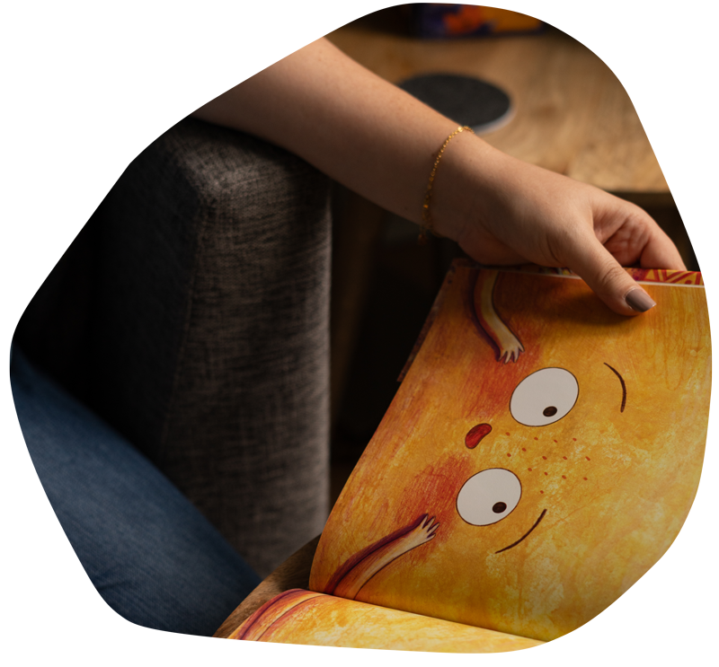 Close up of therapist's hands reading a children's book