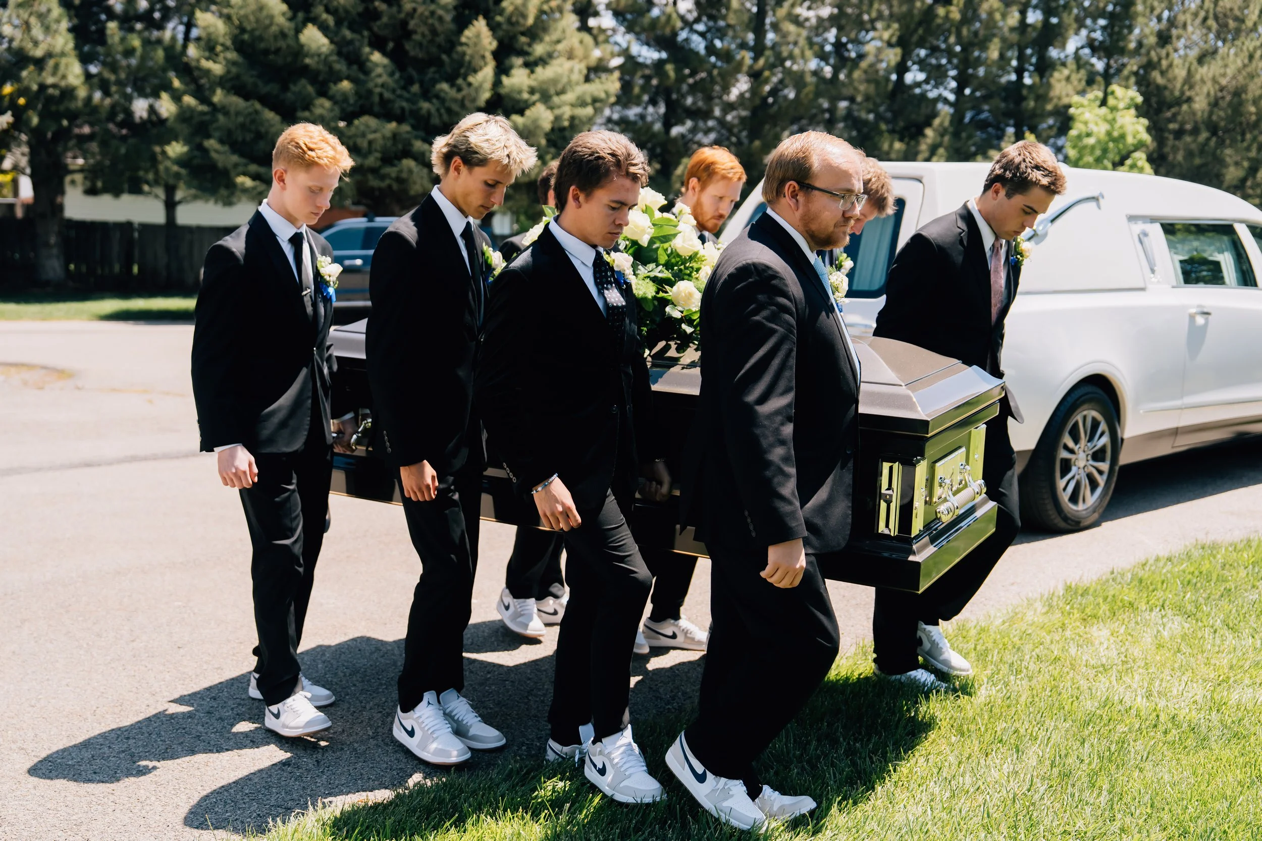 Noah Scribner's friends and family serve as pallbearers at his funeral.