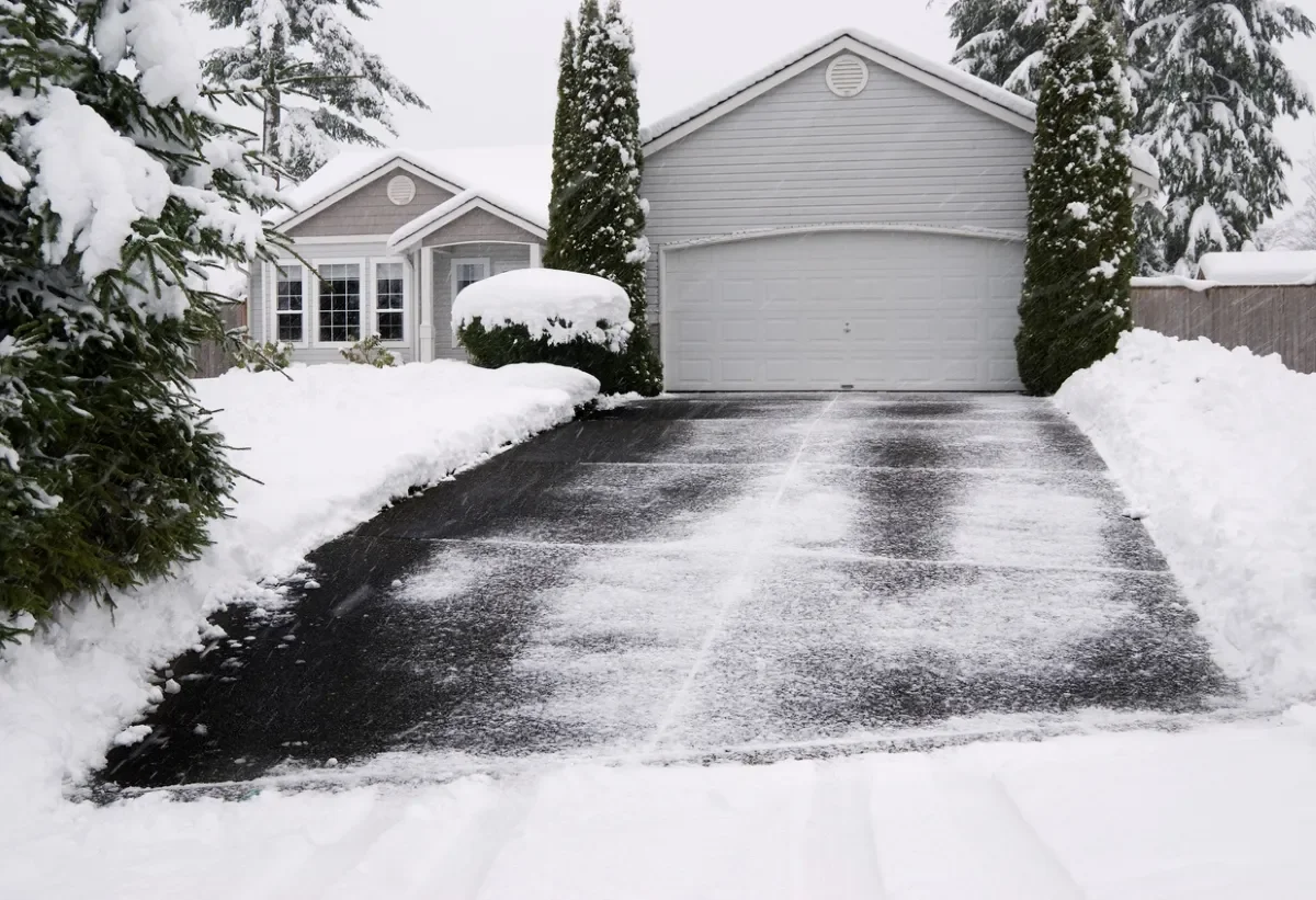 iStock-173575939-how-to-remove-snow-from-a-driveway-without-a-shovel-light-snow-on-driveway.jpg.webp