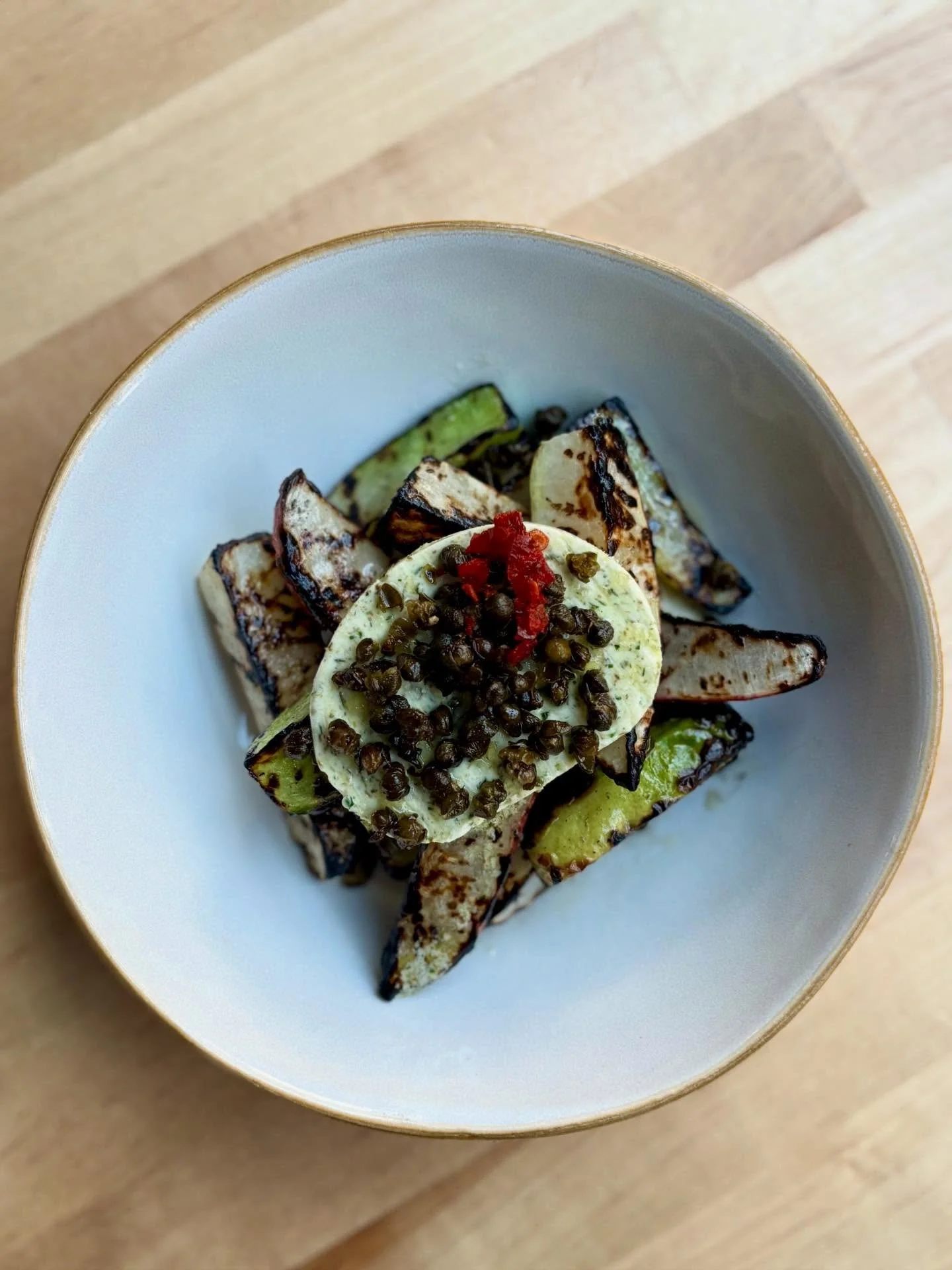 A couple goooooorgeous new plates! Almost time to eat&hellip;. What are your dinner plans 👀

Grilled Winter Radish🫜 rainbow daikon, parsley-bottarga butter, fried capers. On the menu at Queen Anne! 

Winter Panzanella🥖 focaccia croutons, straciate
