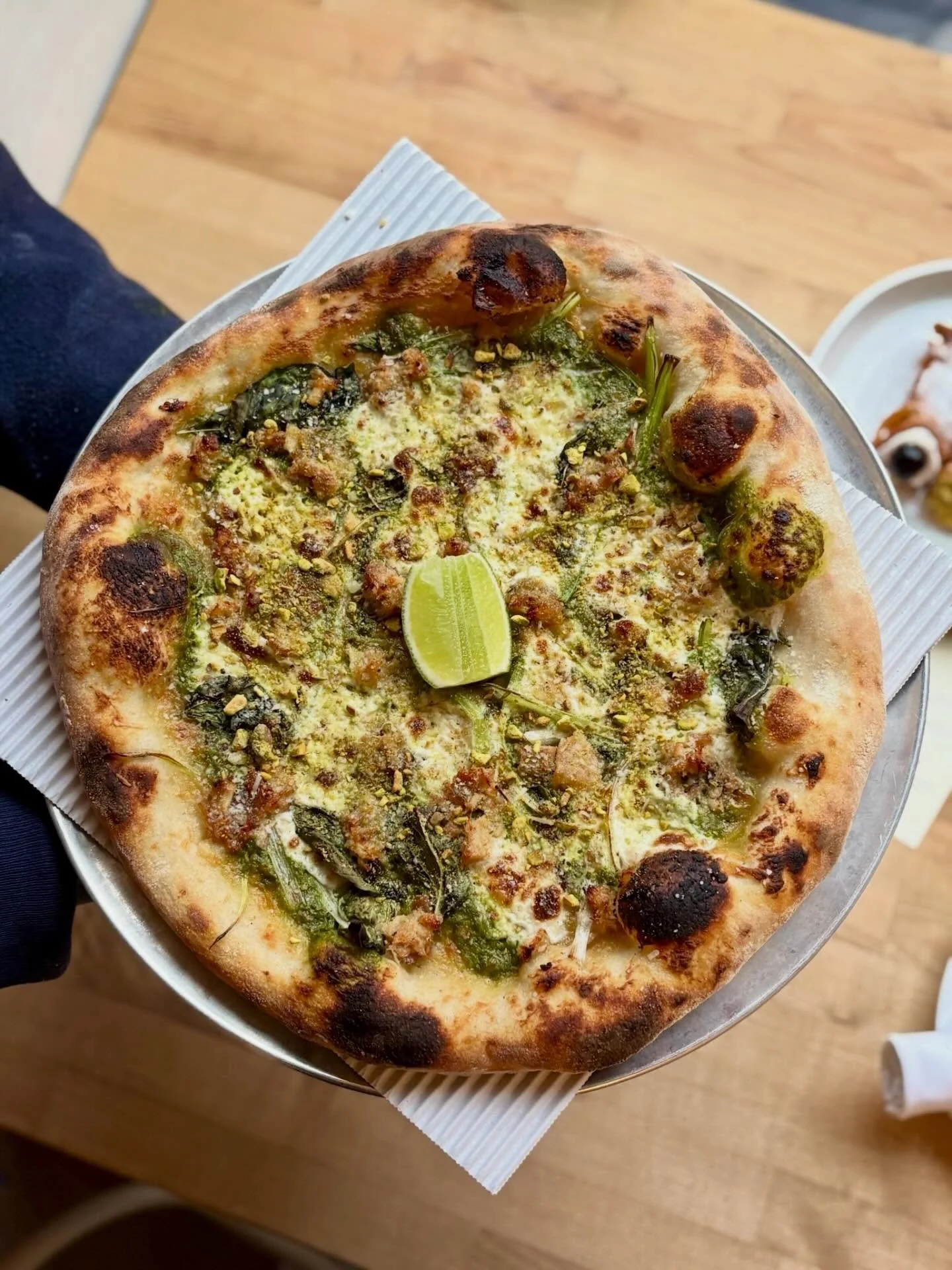 The Green Machine 🌱 Wild onion pesto, house made ricotta, citrus-roasted pork belly, basil, pistachio, parm. Weekend special on Capitol Hill! 

#capitolhillseattle #seattlepizza #naturallyleavened #seattlerestaurants