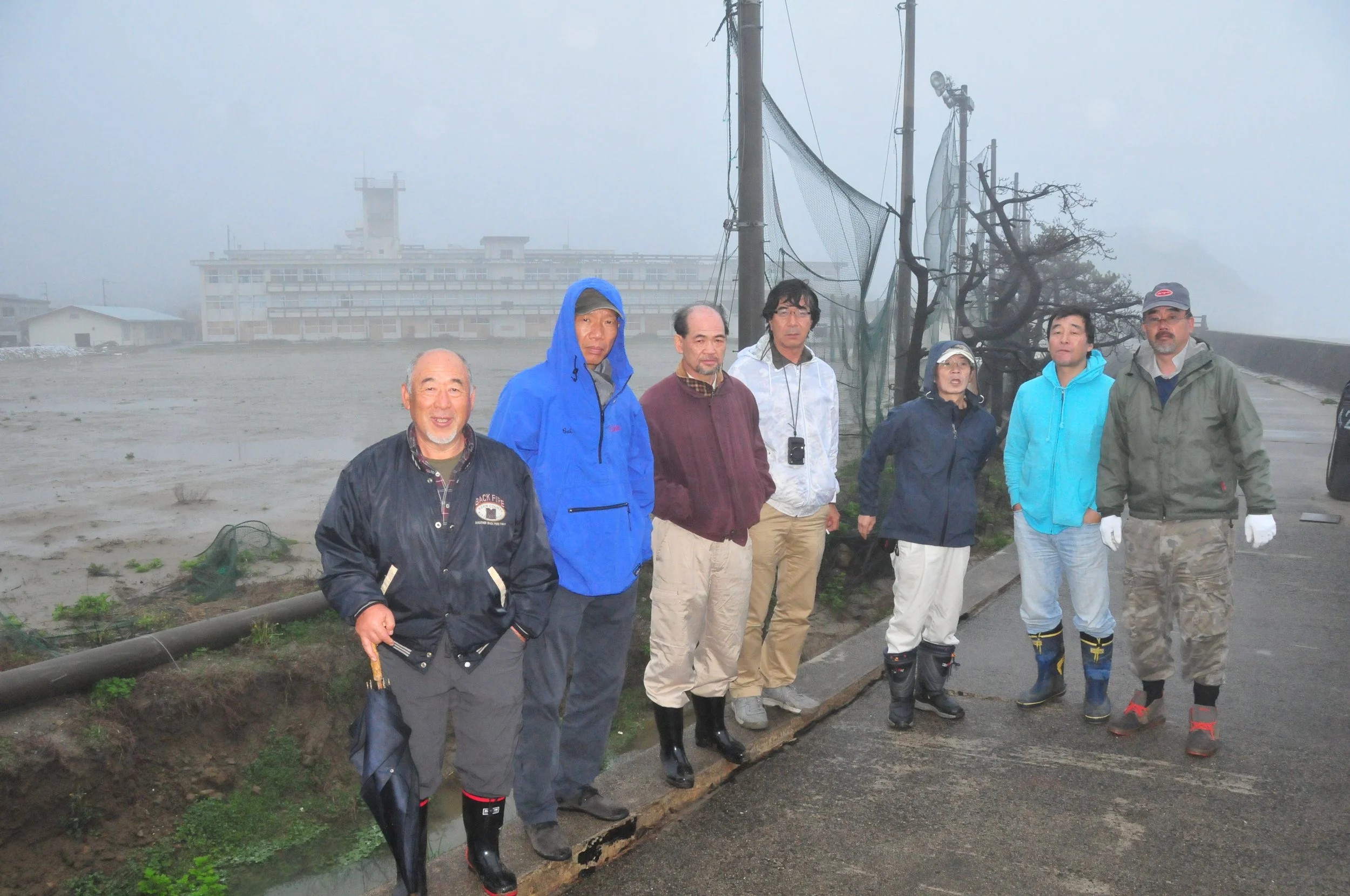  Cai and the Iwaki Executive Committee visiting the site after the Great East Japan Earthquake, 2011. Photo courtesy Cai Studio 