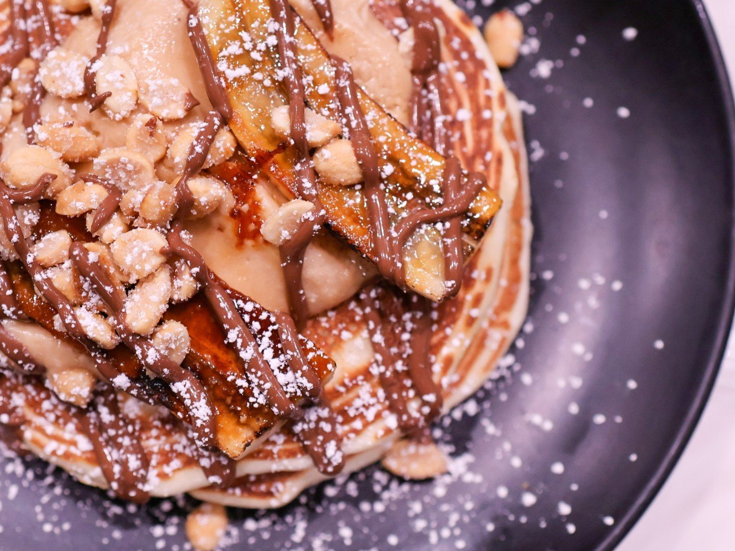 December weekends call for slow mornings and stacked plates ❄️

Our new brunch menu is officially in full swing - come hungry. See you Saturday, 10:30 AM - 2 PM or Sunday, 10:30 AM - 3 PM.

ELVIS PANCAKES | short stack banana pancakes, peanut butter 