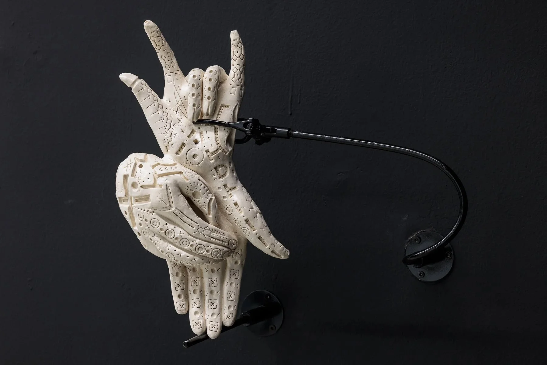 Rodrigo Valenzuela &bull; @rodrigovalenzuela_studio | pieces from Muecas series featuring white ceramic sculptures cast from his own hands, posed in contorted, ambiguous gestures and mounted onto aluminium pipes and metal armatures. 

Inscribed on th