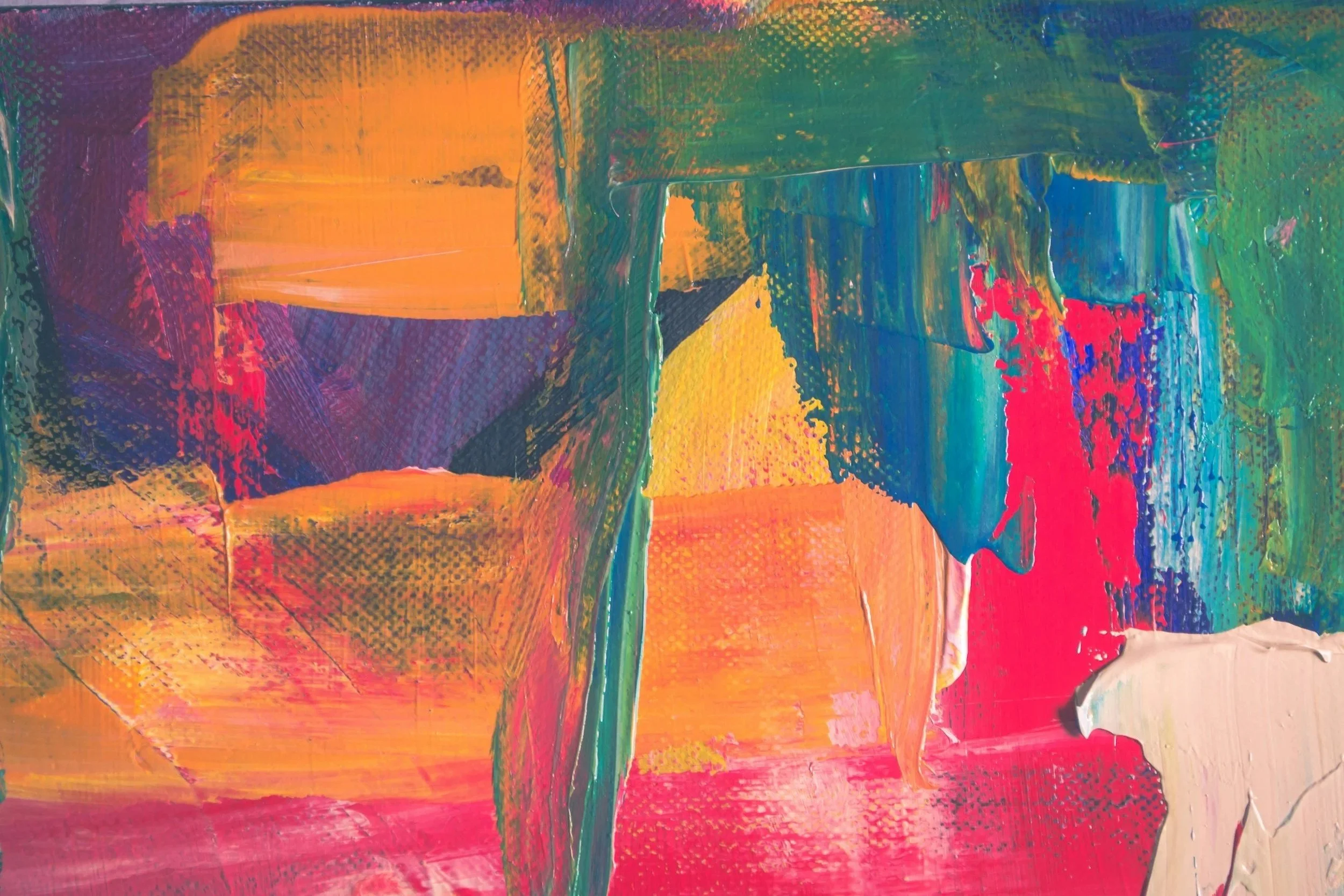 Abstract colorful painting with vibrant splashes of orange, purple, green, red, and blue.
