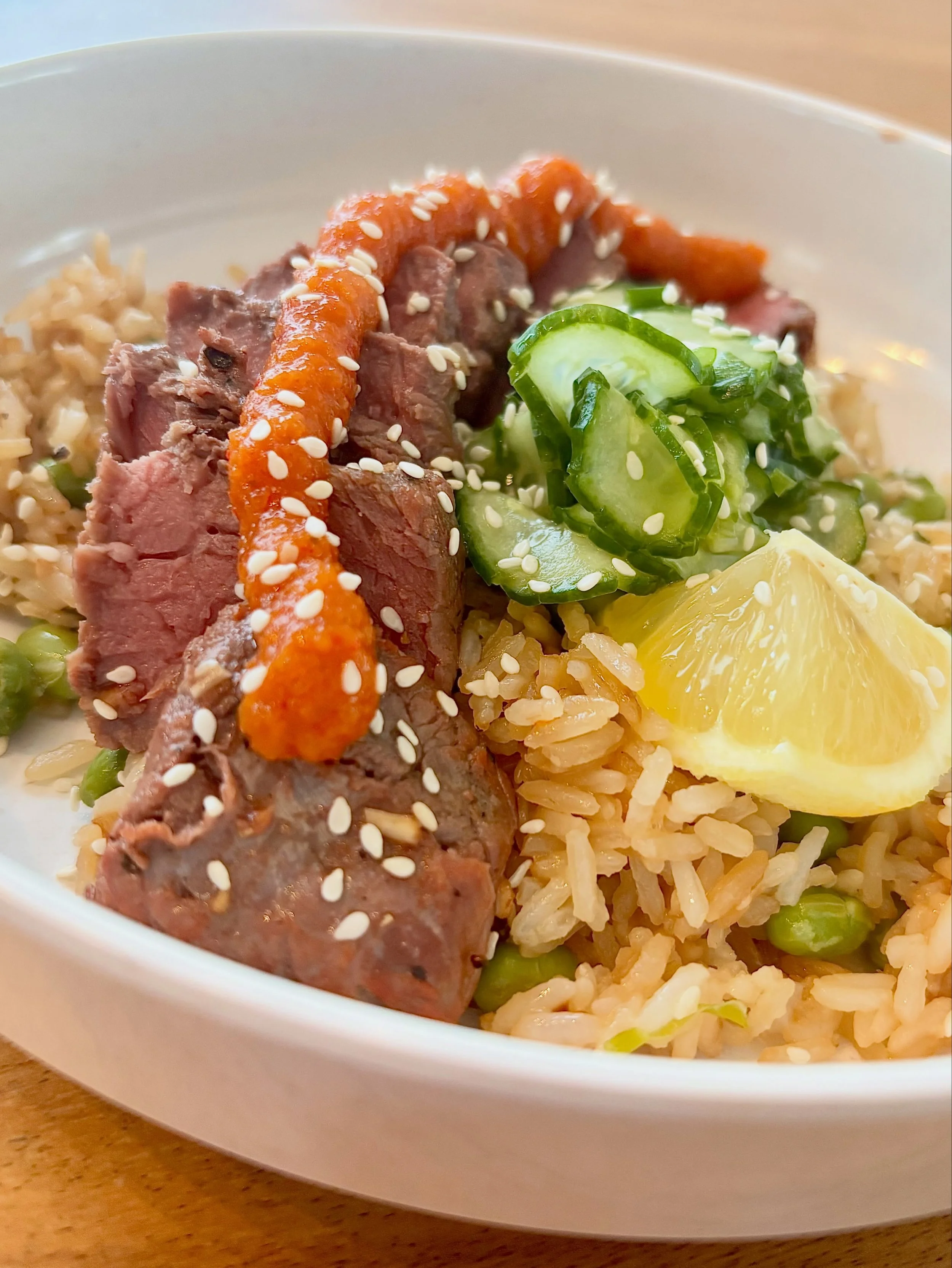 Protein, veg, rice, WeChi 🙌 One of the easiest (and tastiest) ways to add a flavorful probiotic boost to your weeknight dinner routine. In this case: soy-ginger-marinated steak with quick-pickled cucumber, edamame fried rice, sprinkle of sesame seed