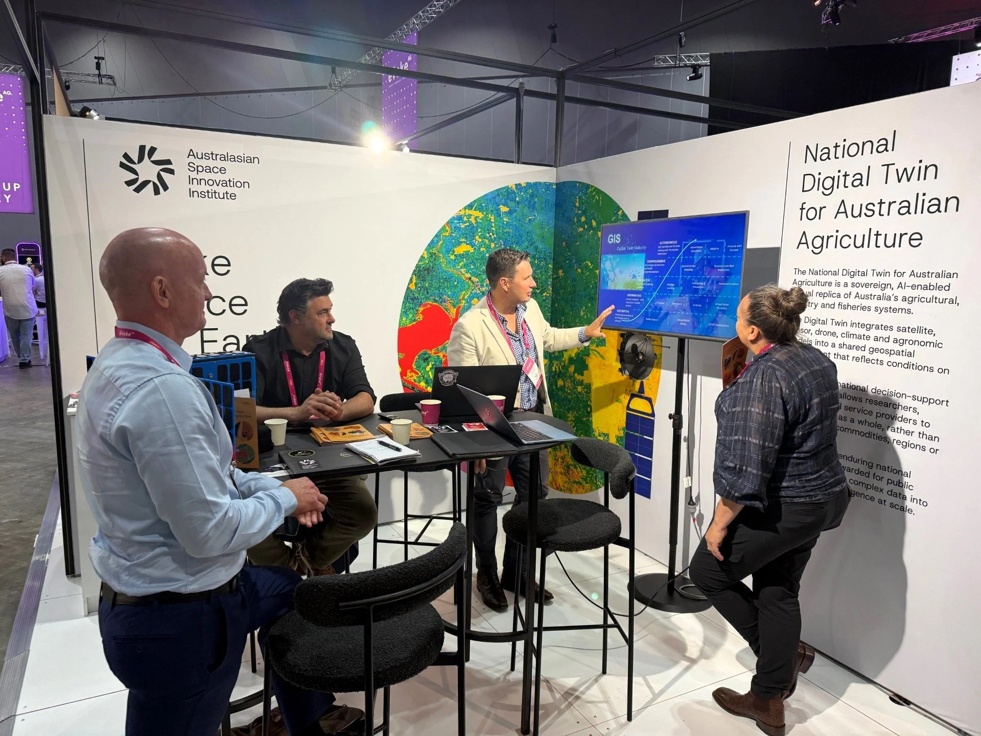  ASII team members (L-R) Cameron Stevenson, Fabrice Marre and Andrew Beveridge on the ASII stand presenting the technology behind the Digital Twin. 