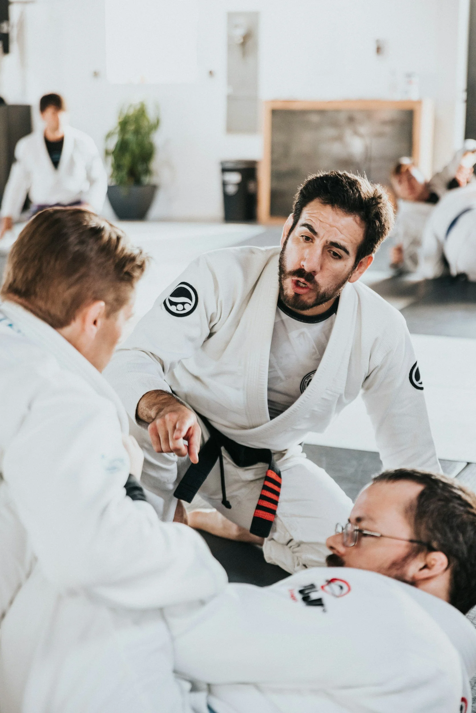 BJJ black belt teaching his students