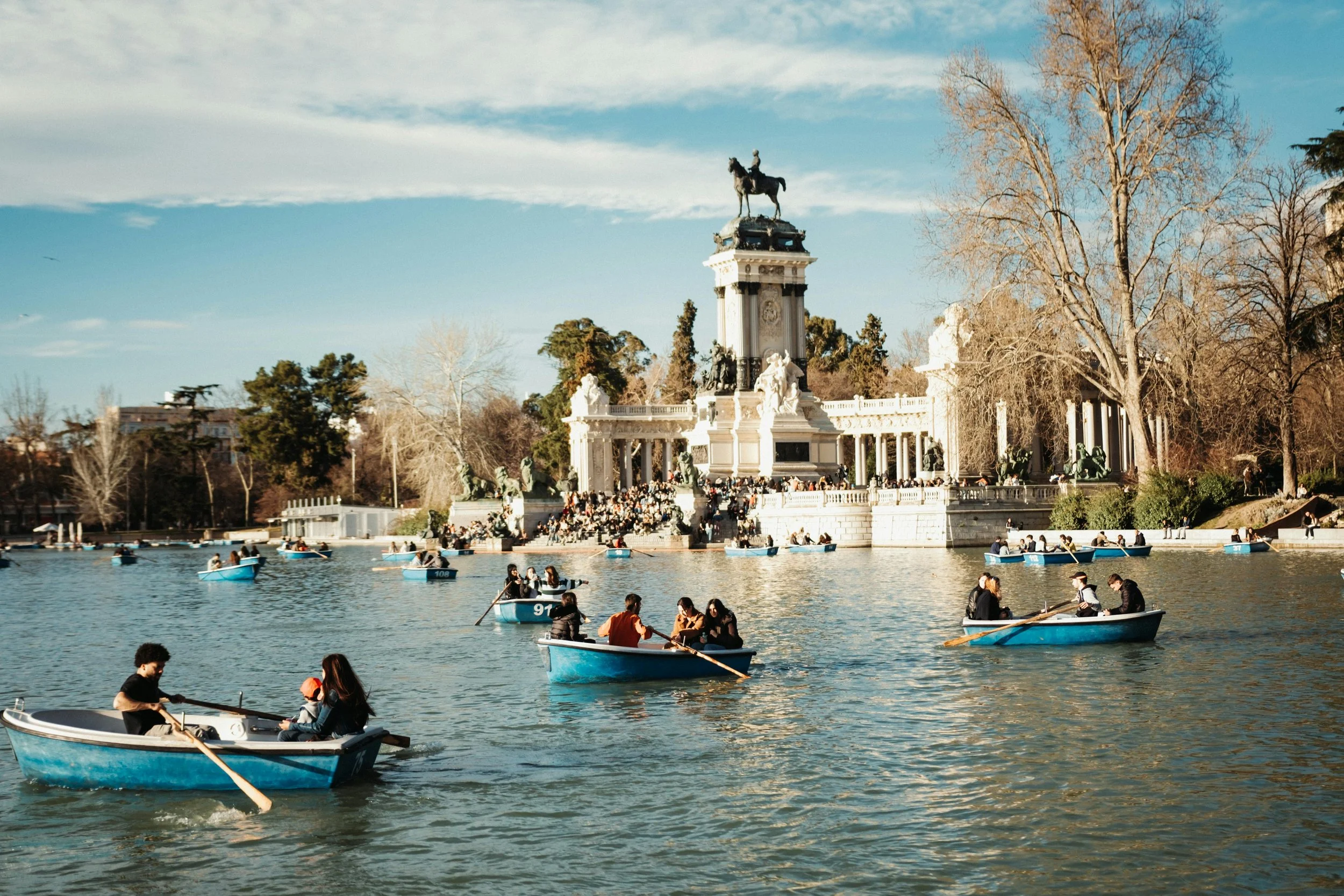 People in boats on a lake in Madrid