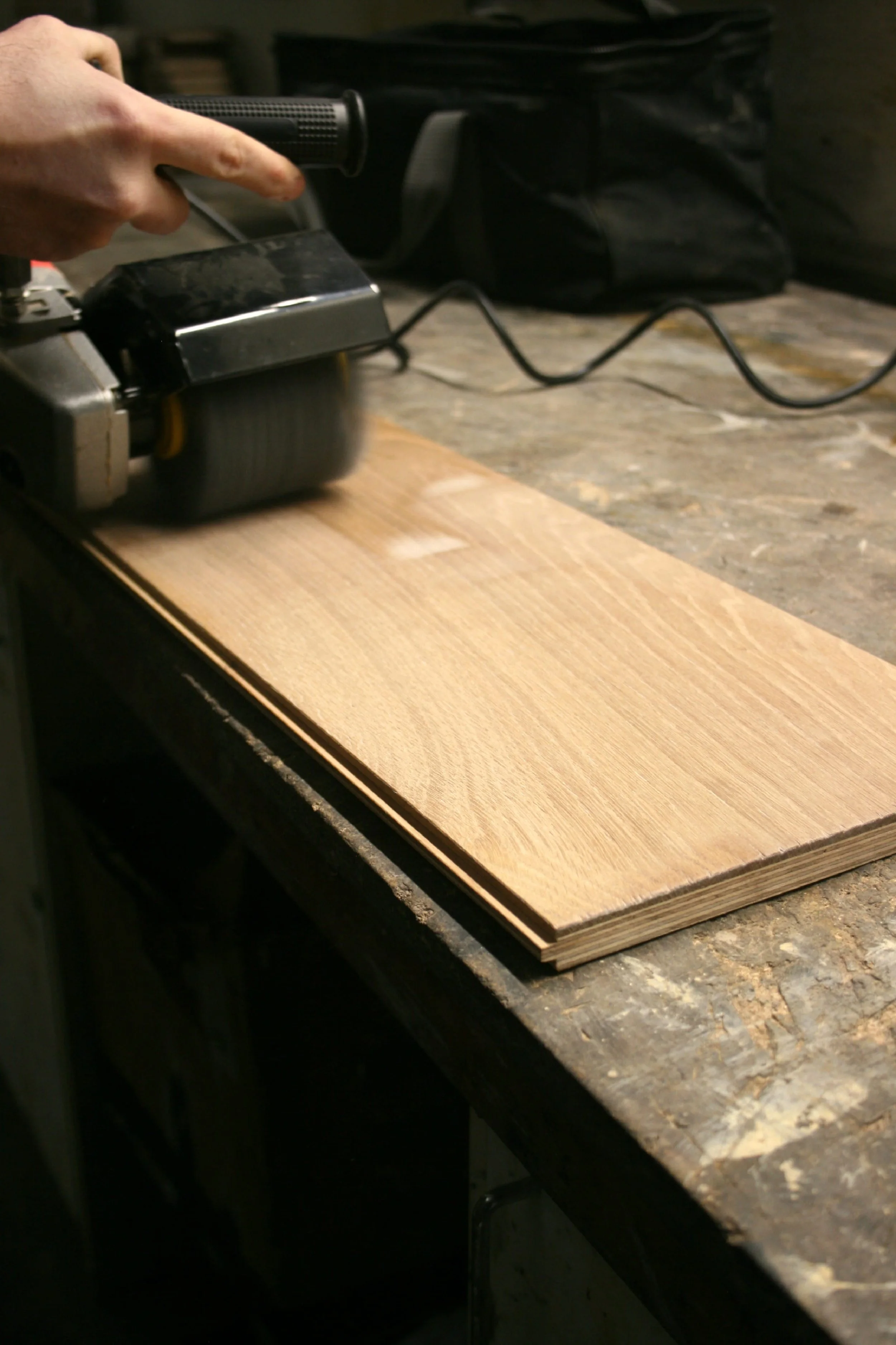 Hand finishing wood flooring with brushing machine