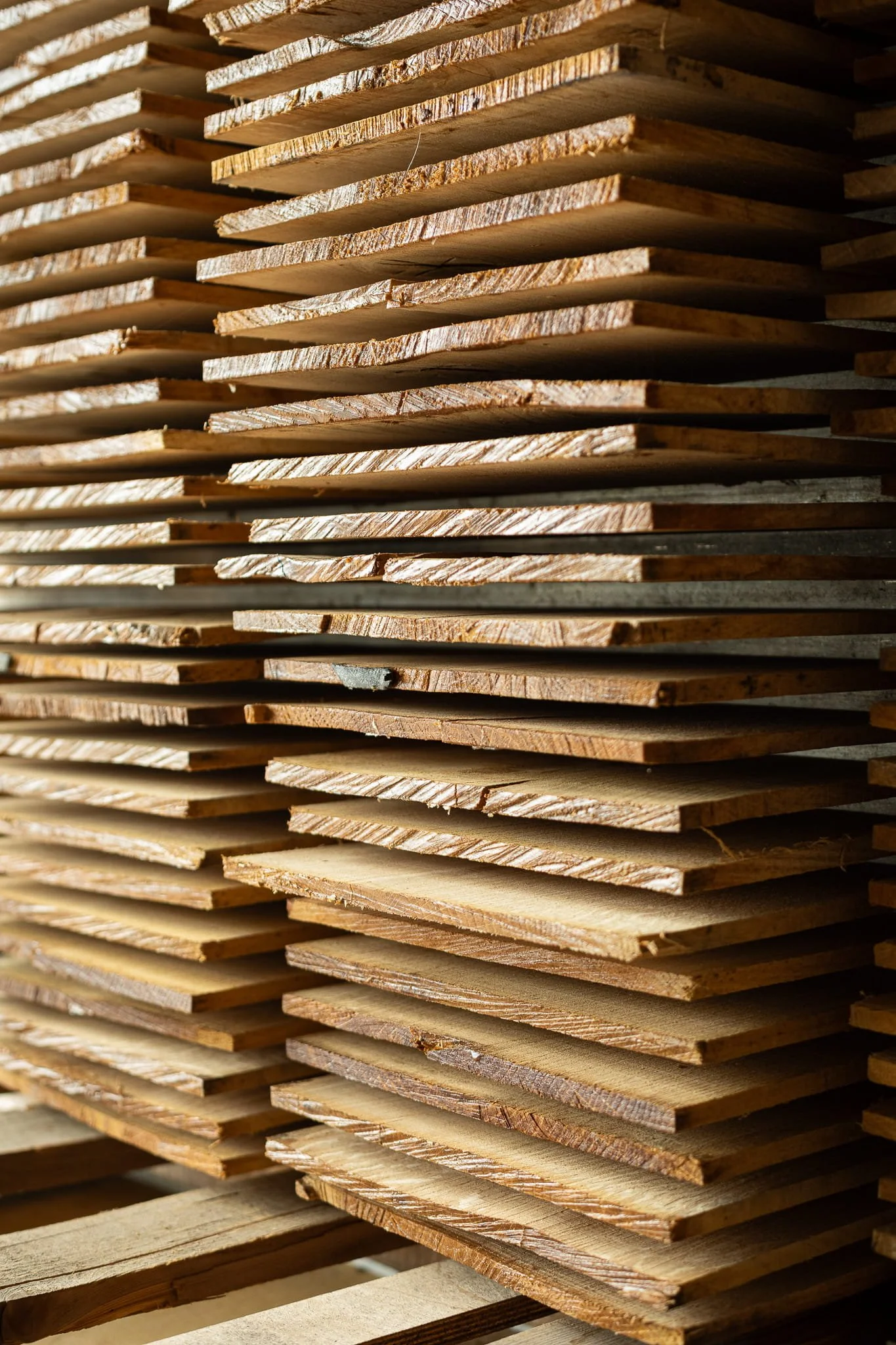 Bespoke timber flooring sustainable raw material unfinished stacked to dry