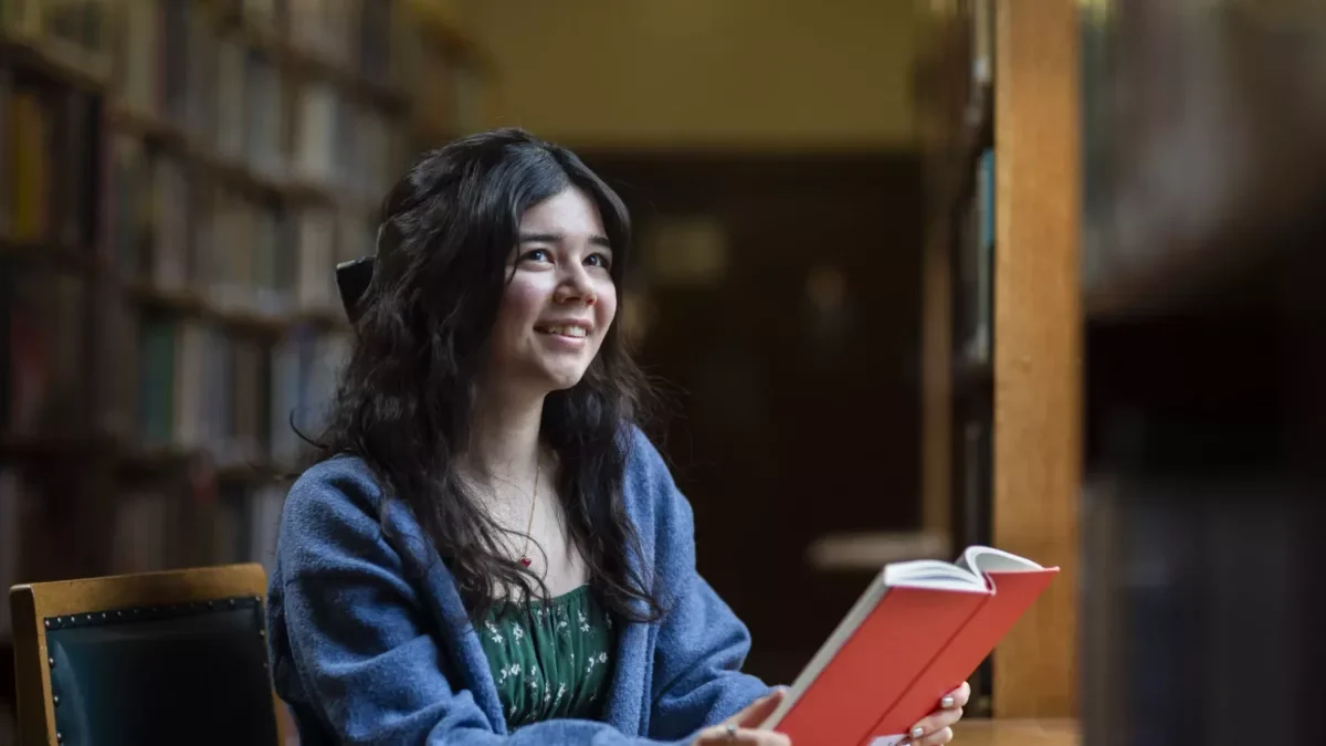 Girl reading at desk at Winchester College summer school