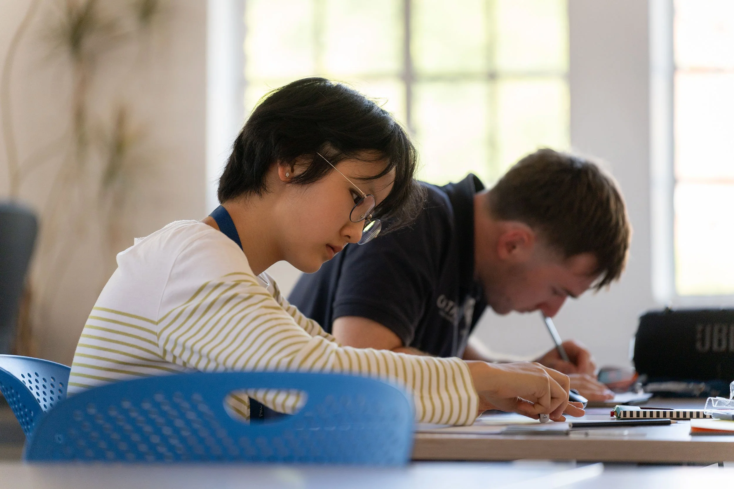 student writing in class