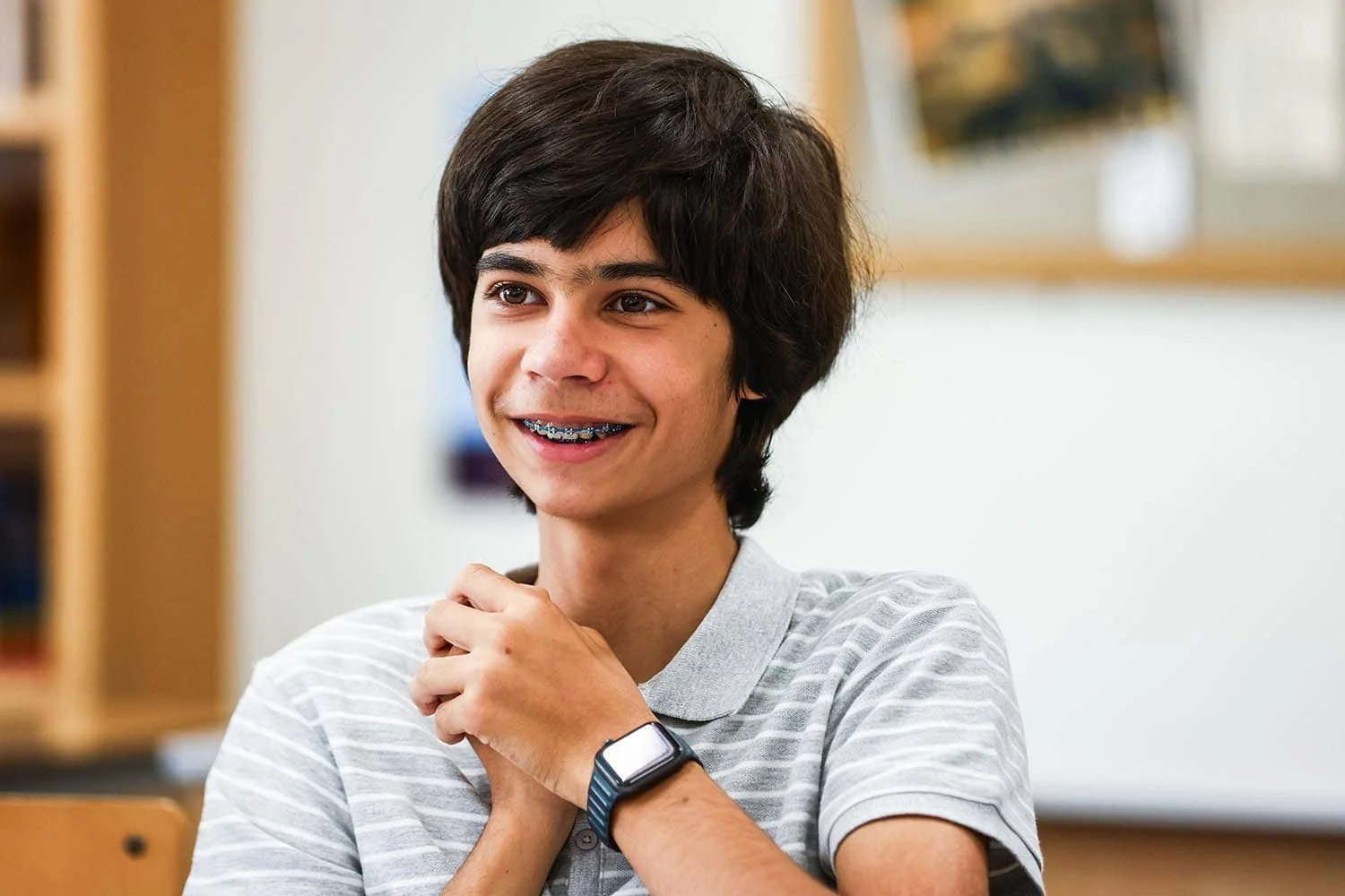 Boy smiling in classroom