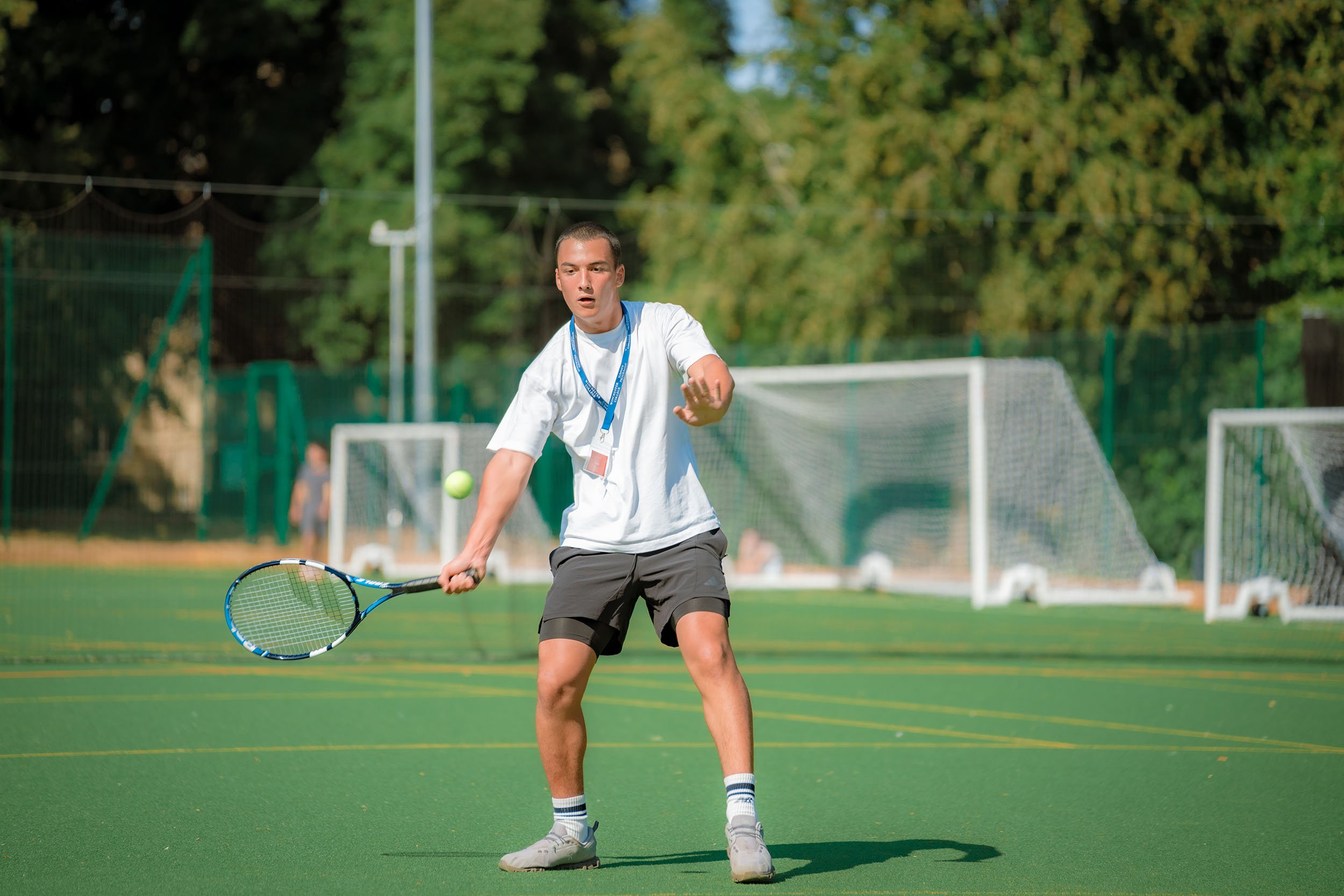 Tennis coach leading session