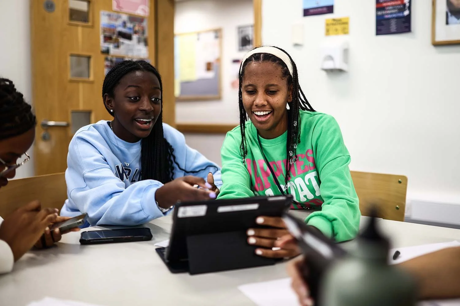 Girls engaging in discussion on English Language Course at Winchester College in England