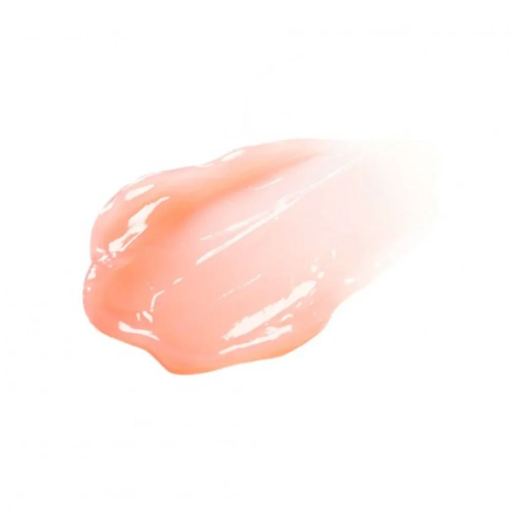 Image macro de la texture du Tocobo Vita Glazed Lip Mask. Touche épaisse de baume à lèvres rose pâle, ultra-brillant.