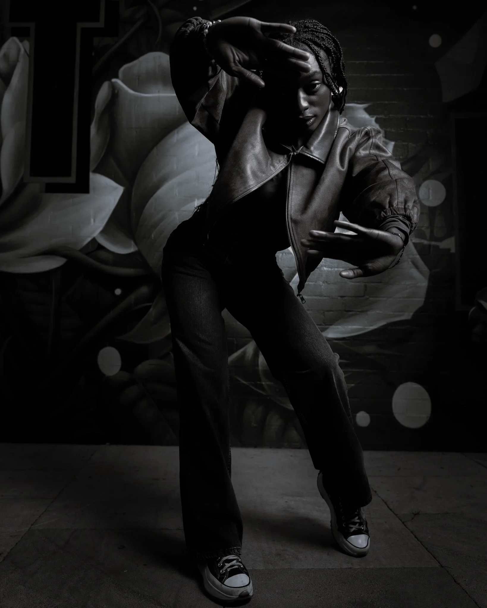 Cinematic full-body shot of a woman in a dynamic stance, using vibrant mural textures, natural light and expressive gesture to create depth and motion — signature cinematography by ABHIOLAR.ART.