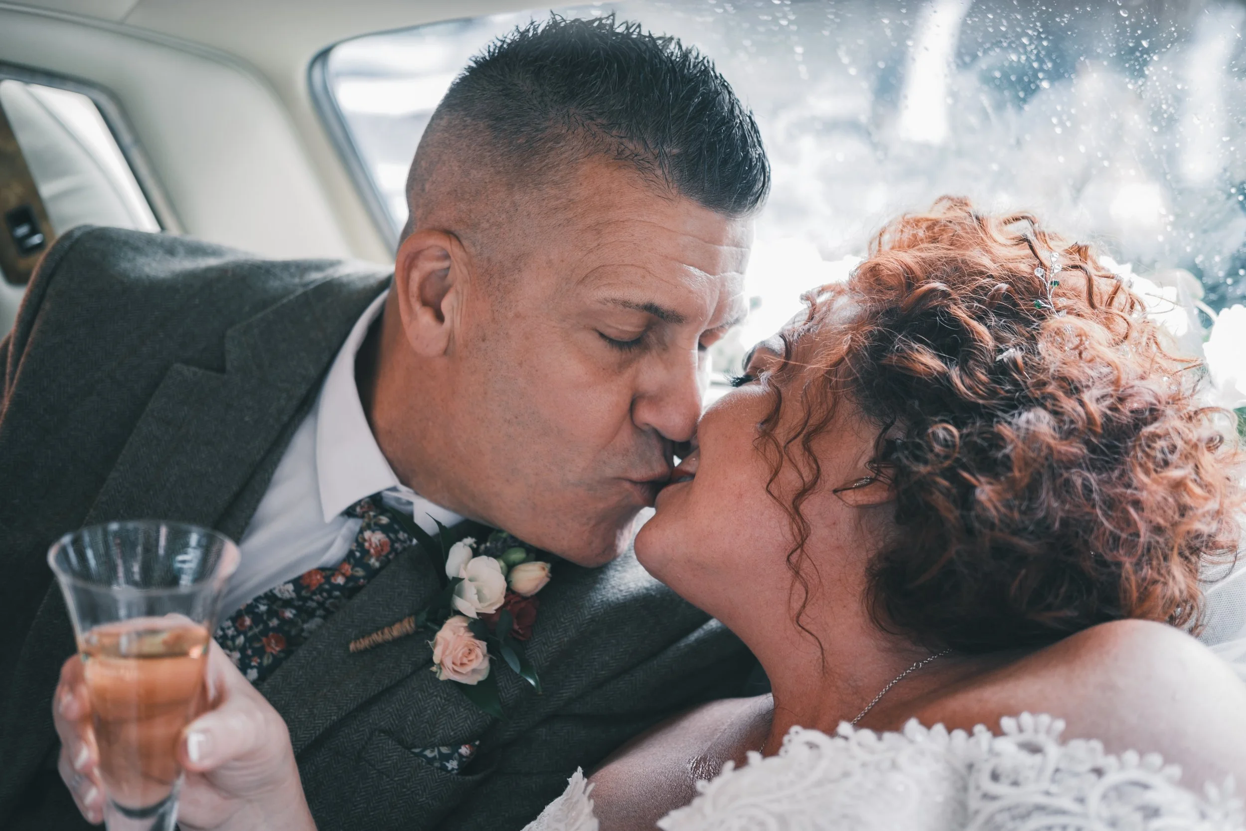 Mr & Mrs back of the car kiss 2.jpg