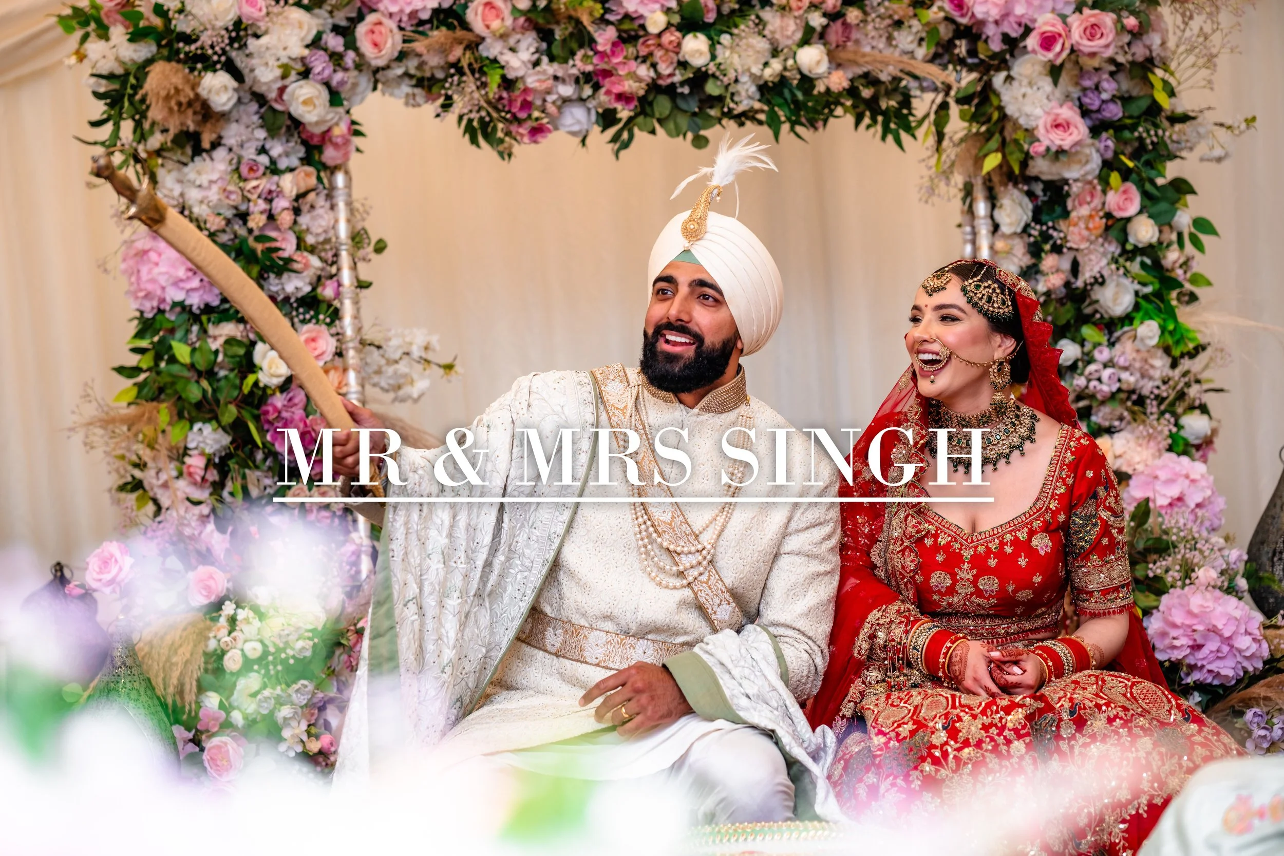 Indian bride and groom in traditional attire at their wedding, sitting in front of a floral backdrop, with the text 'Mr & Mrs Singh' overlaid.