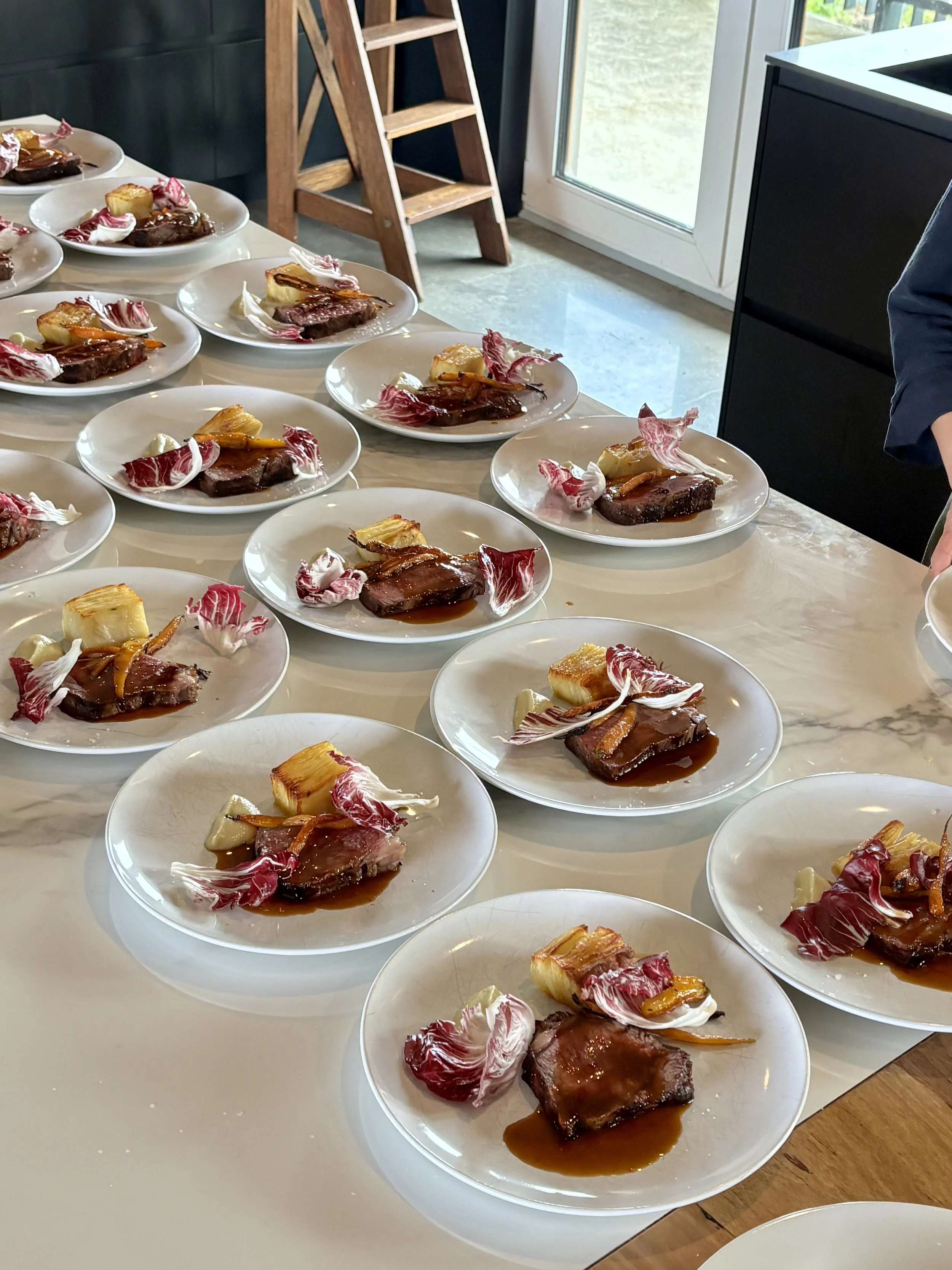 Signature experience being plated at a bespoke event in Mornington Peninsula Victoria. Wagyu steak, farm fresh vegetables.
