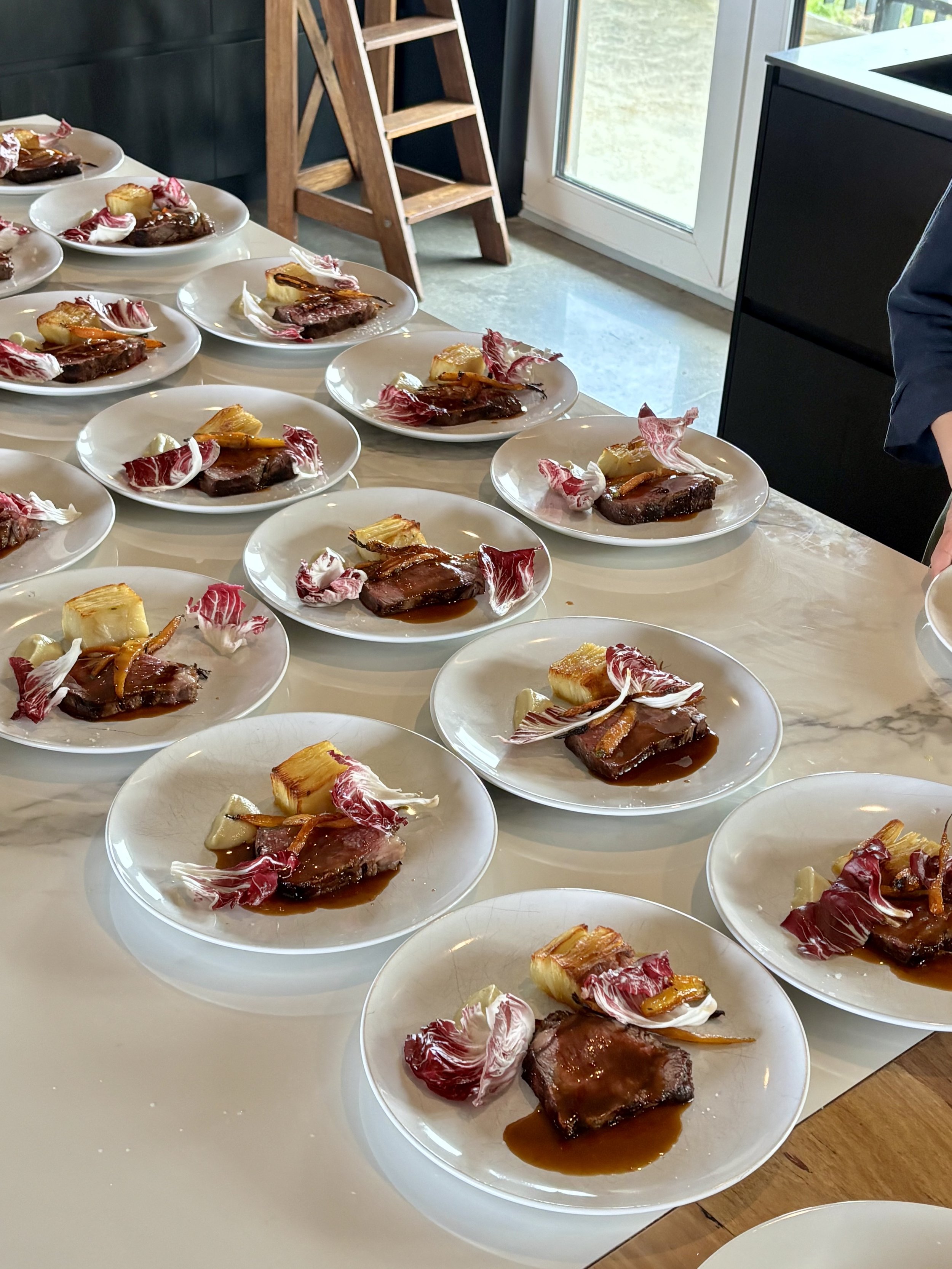 Signature experience being plated at a bespoke event in Mornington Peninsula Victoria. Wagyu steak, farm fresh vegetables.