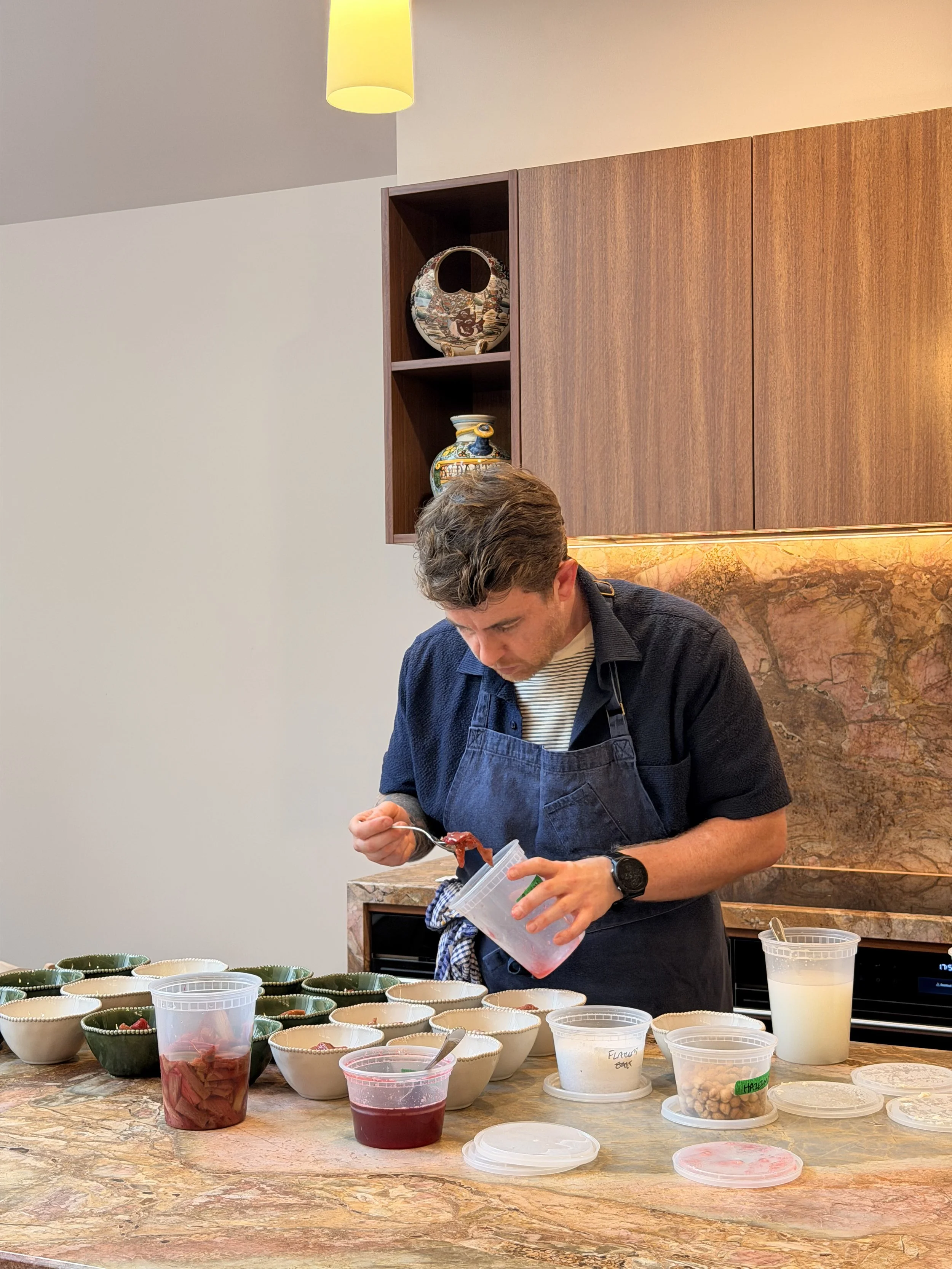 Chef Pete Townsend plating up dessert at a private event in South Melbourne. Private dining in-home experiences